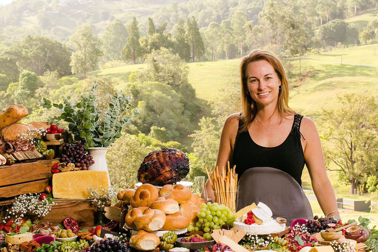 A collage of rustic food scenes with fresh produce, bread, wine and flowers arranged on wooden tables in outdoor settings.