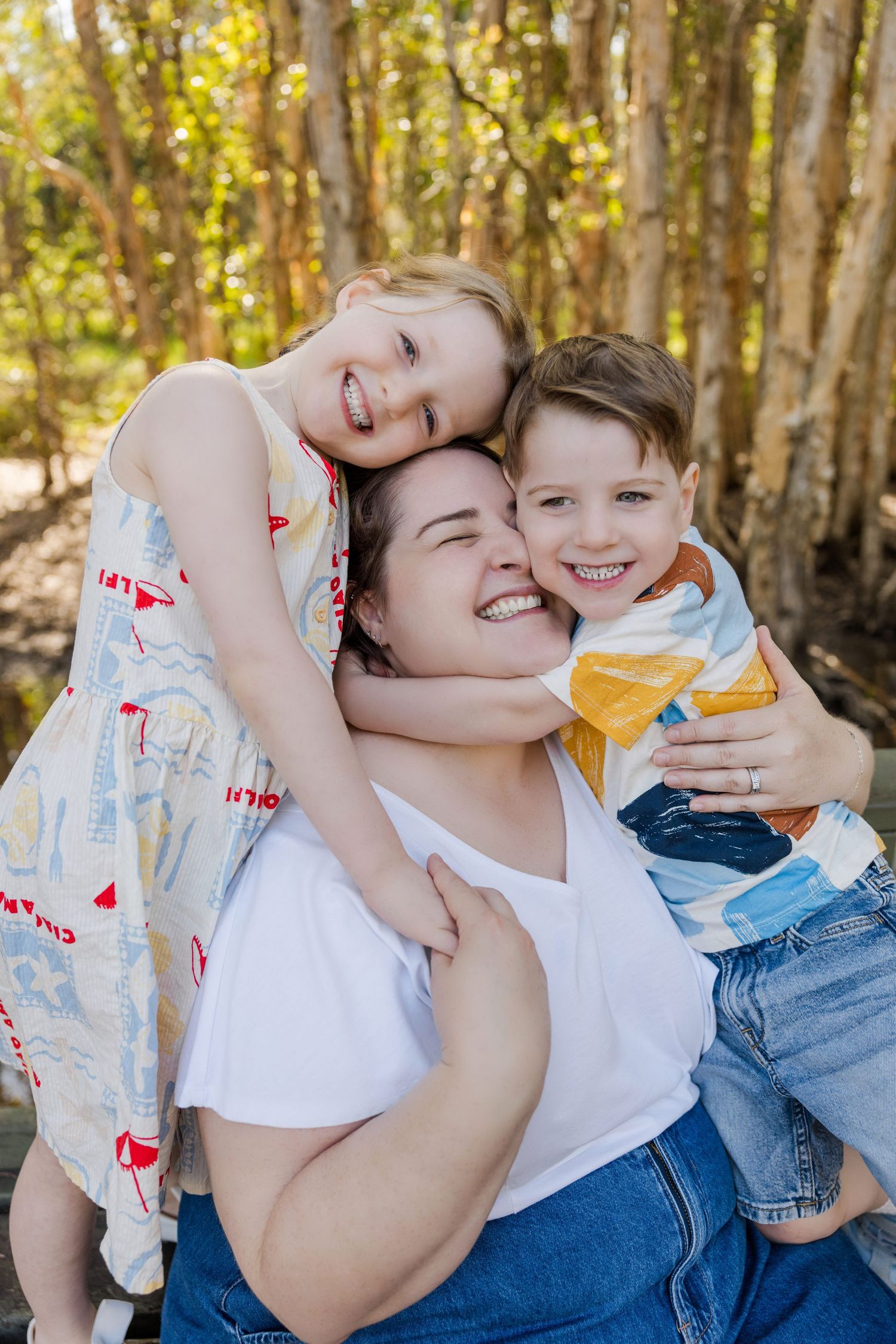 A heartwarming sequence of candid moments between parent and child playing together in a sunlit forest setting.