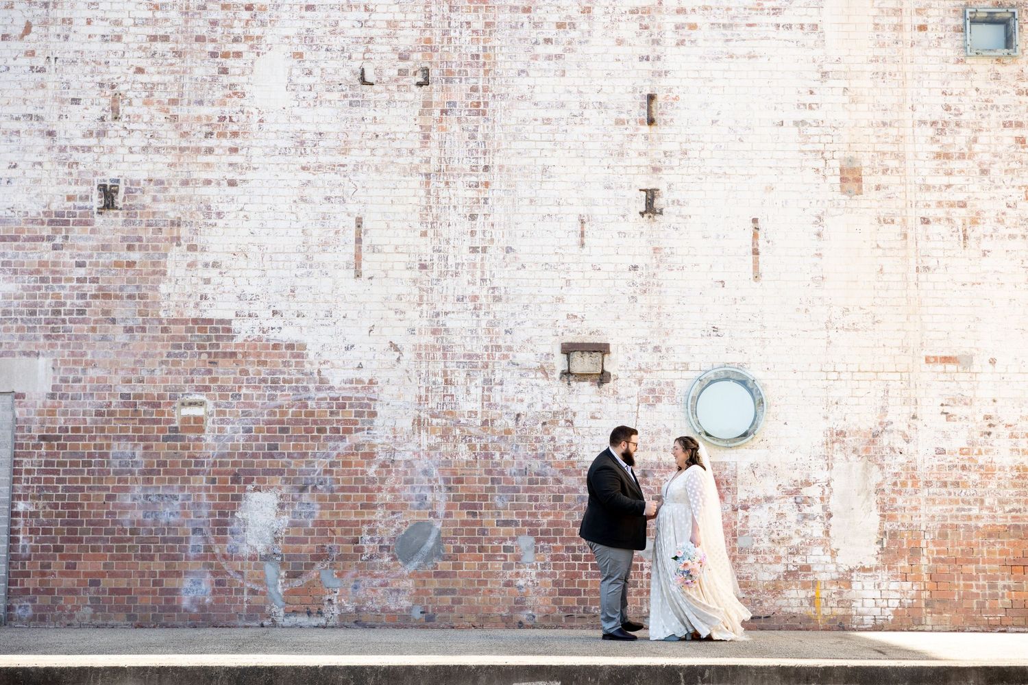 A sequence of brick wall photos showing progressive stages of cleaning and restoration work.