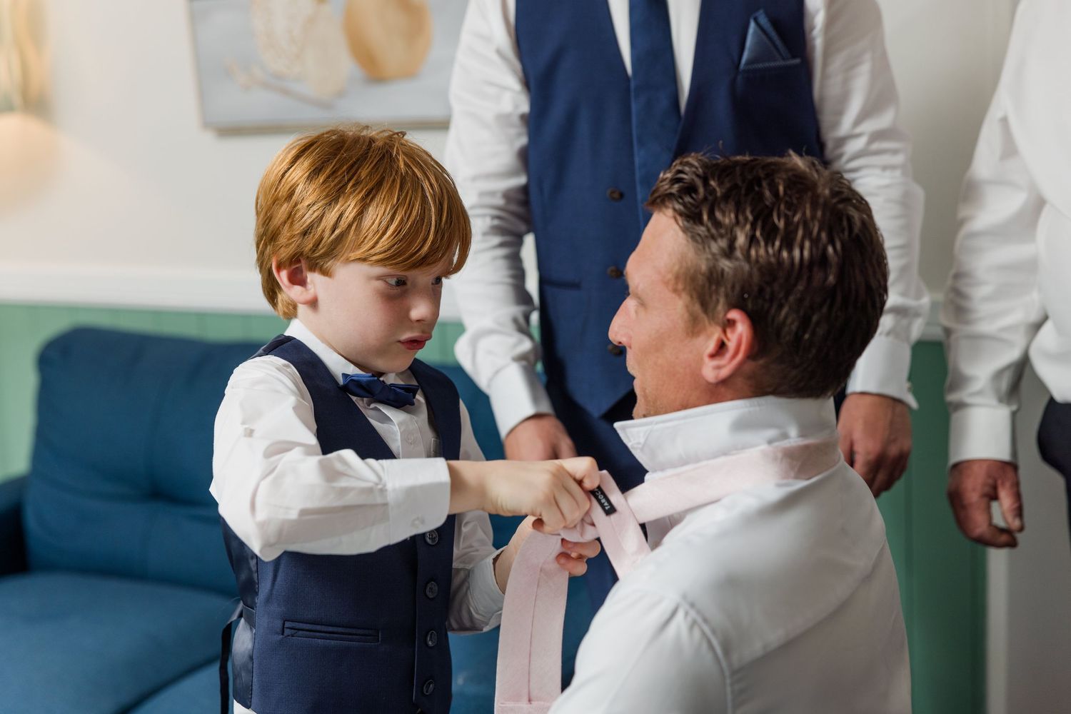 A collage of four images showing people in formal attire interacting with each other at what appears to be a wedding event.