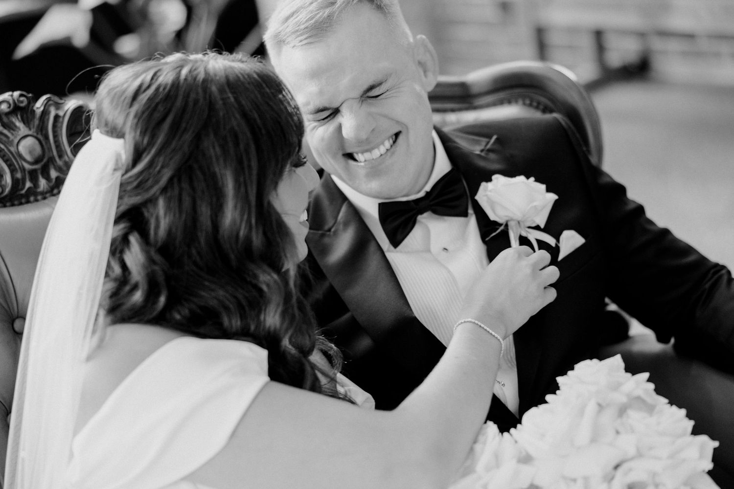 A black and white collage of candid wedding moments showing laughter and joy during a celebration.