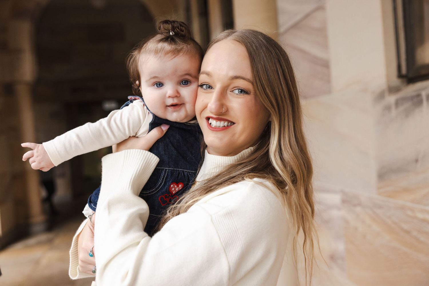 A mother and baby share joyful moments together in a series of candid photos.