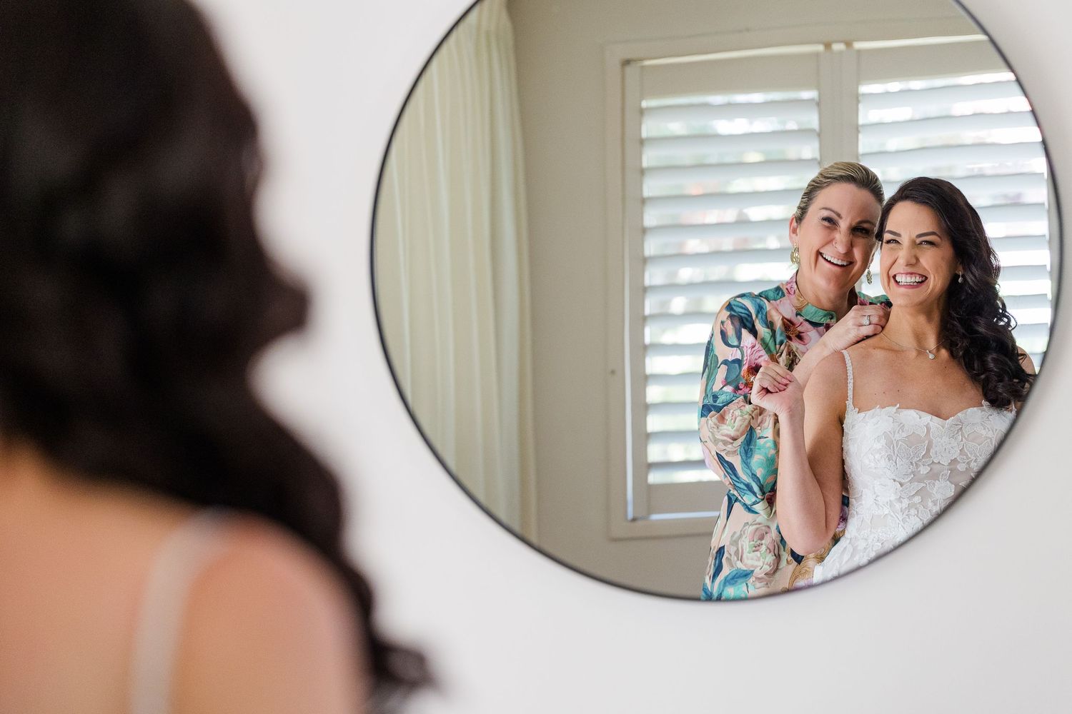 A series of wedding preparation moments captured in circular mirror reflections showing a bride getting ready.