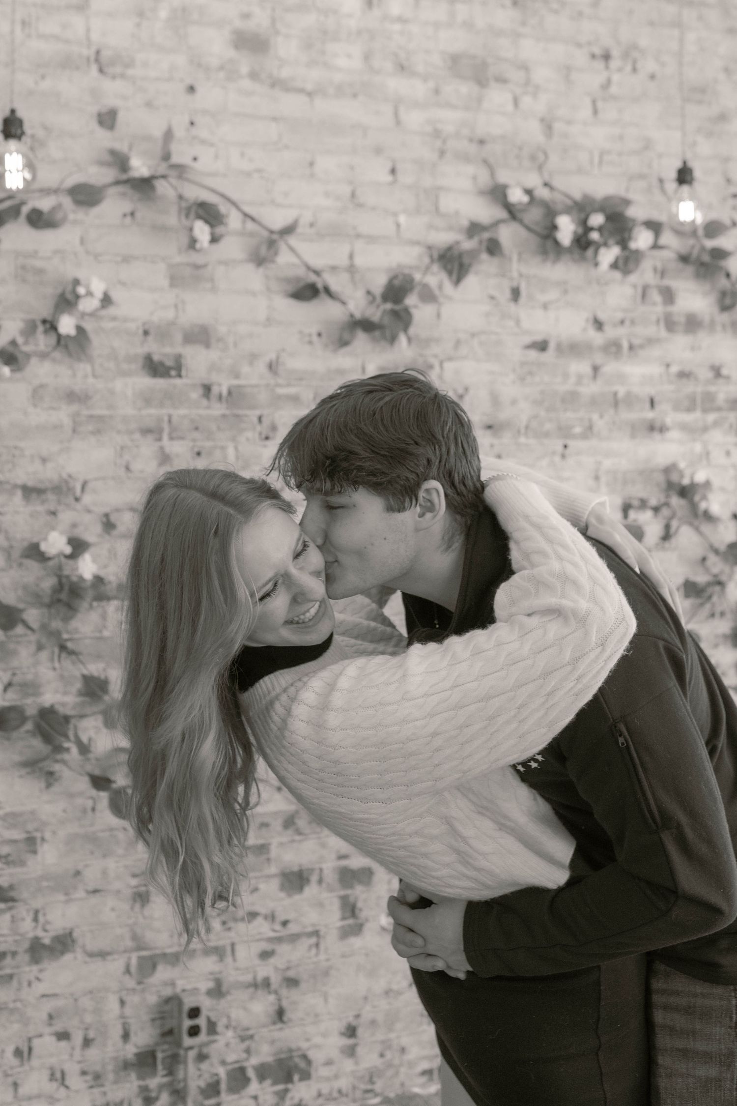 Couple laughing together in flower studio