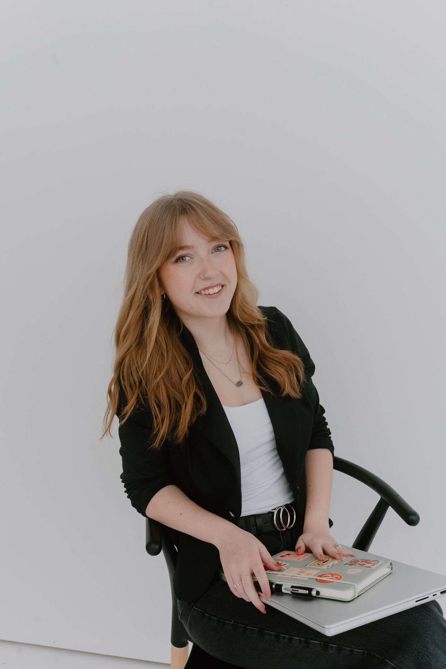 Clean studio branding portrait with soft lighting and brick backdrop