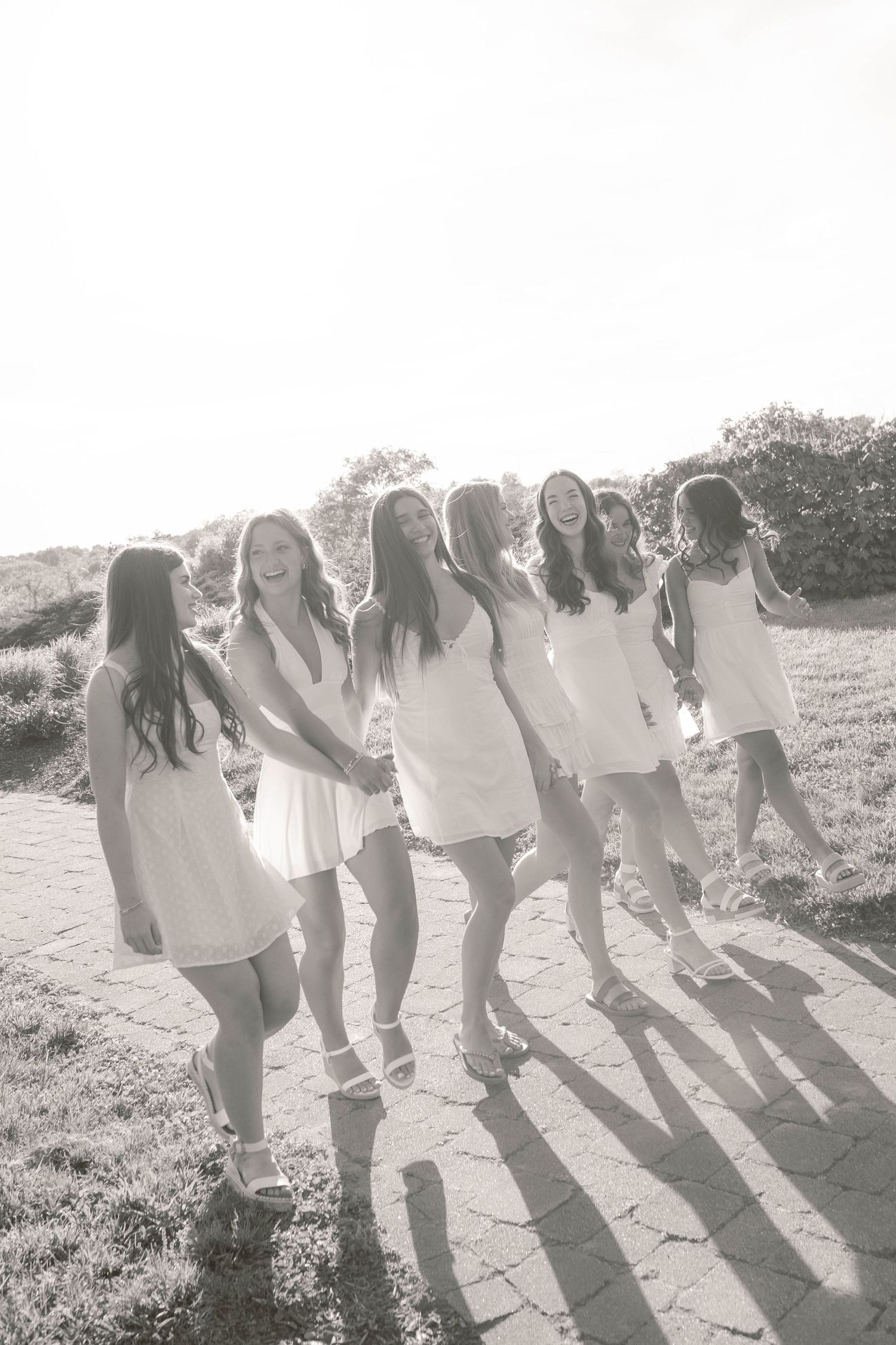 Group of senior girls walking in field laughing together