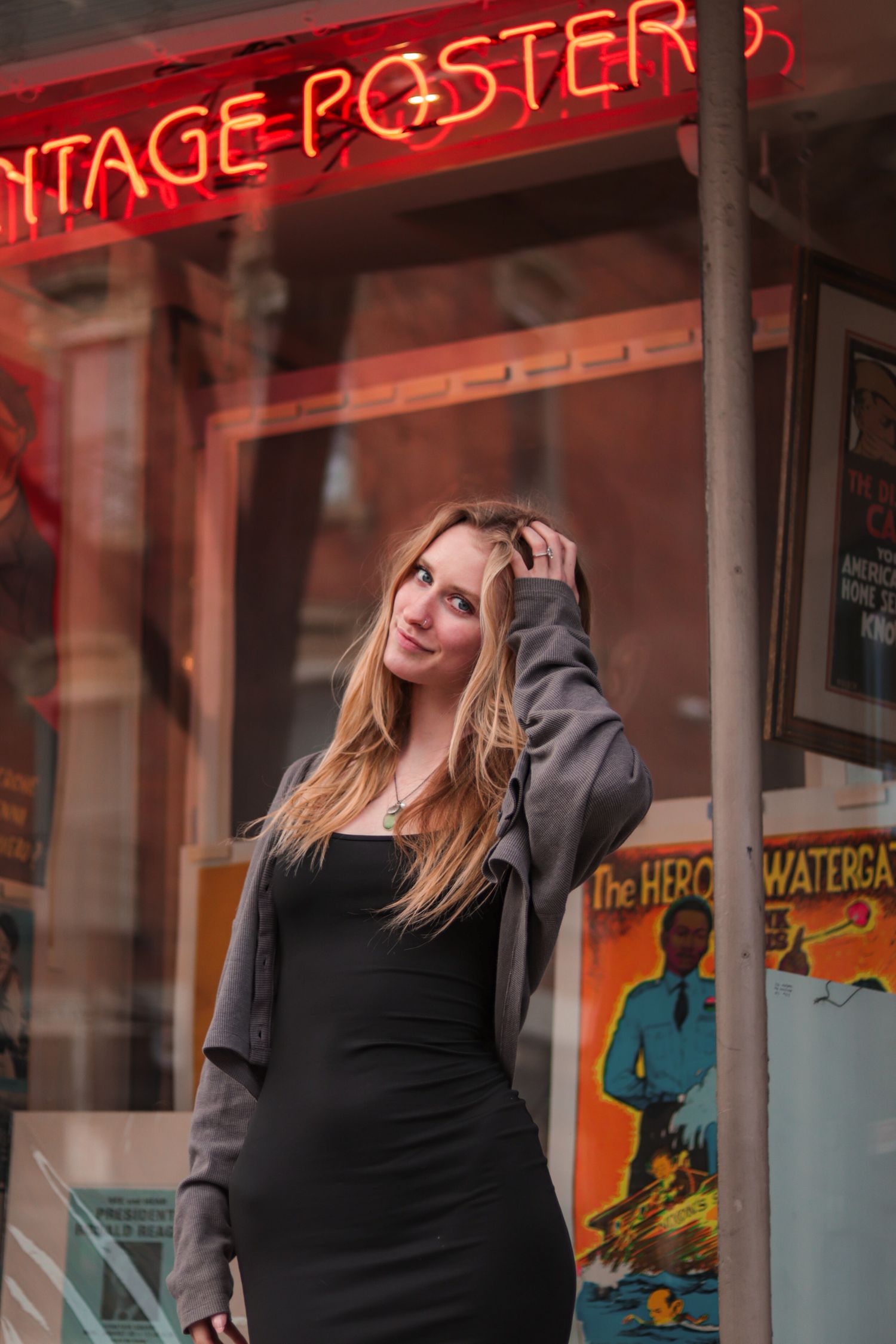 Woman standing in front of vintage store for portraits