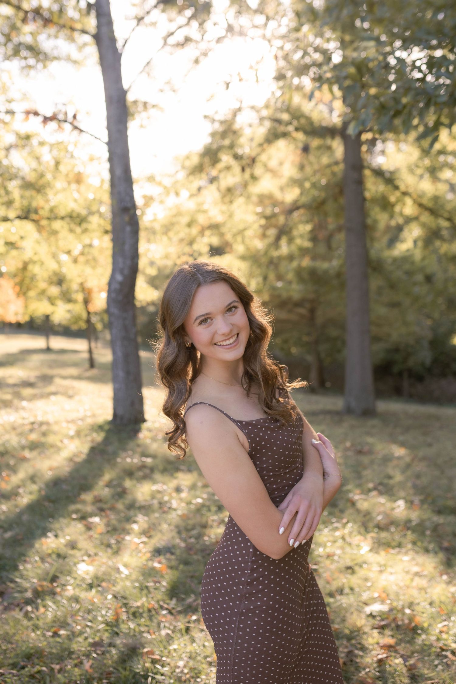 Girl standing and laughing in park
