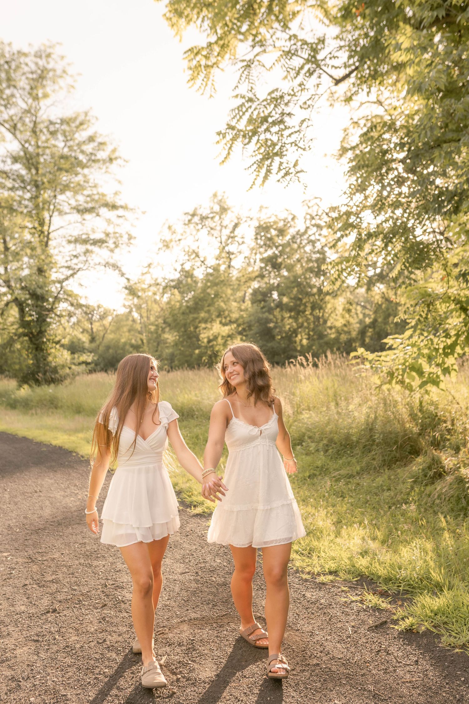 Best friend senior photos outdoors during sunset at park