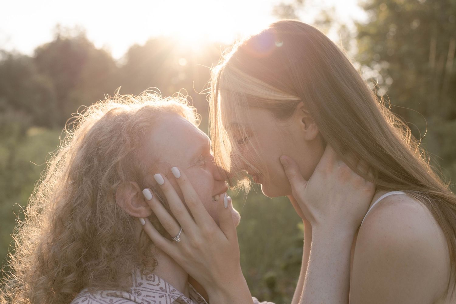 Couple looking into each other's eyes during sunset