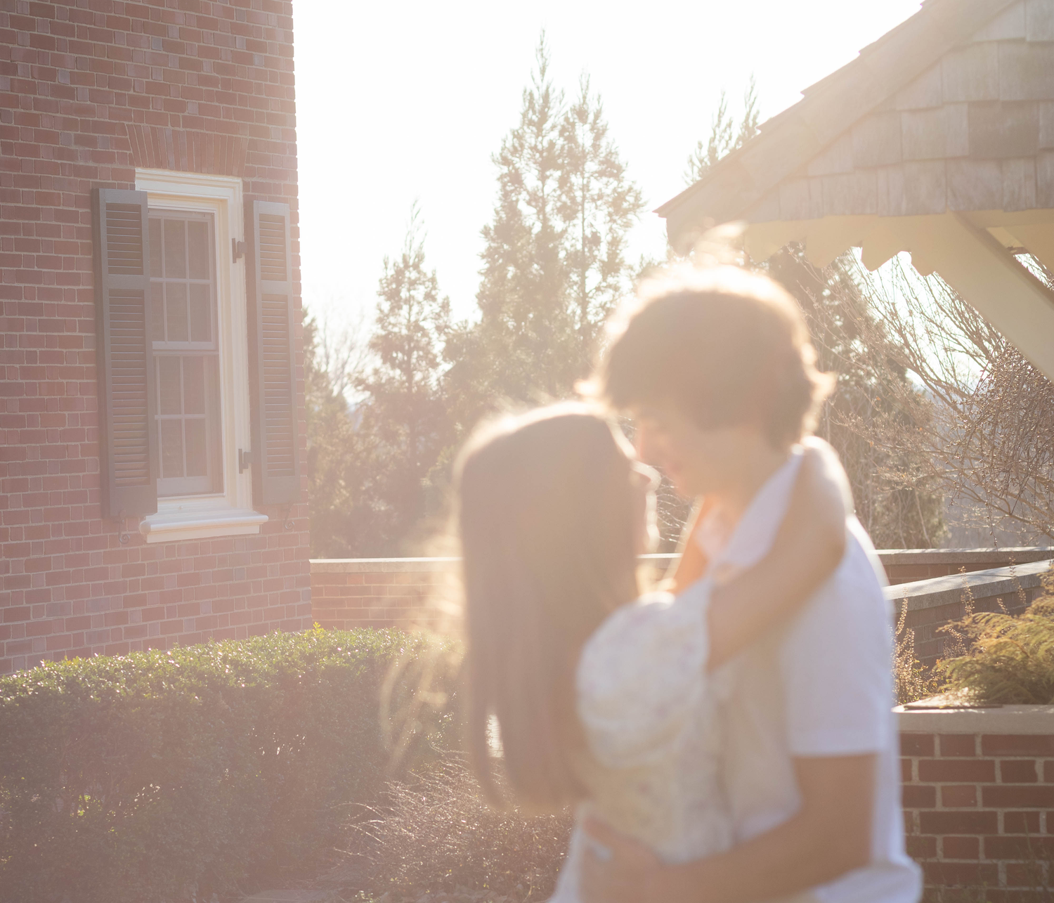 Romantic outdoor couple session with blur and soft golden hour lighting