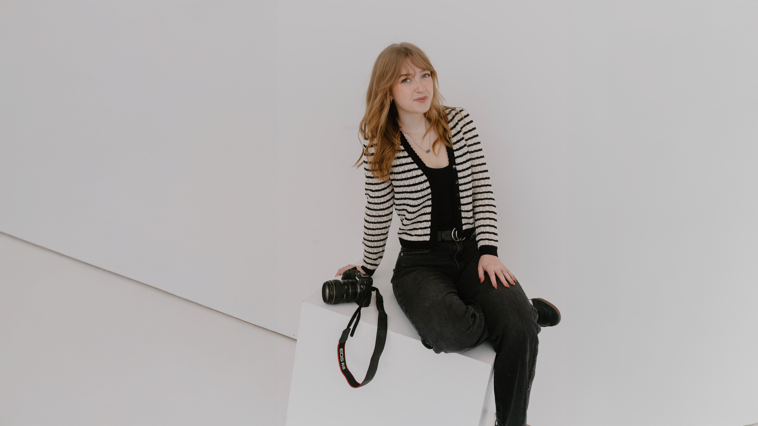 Studio headshot of entrepreneur in modern outfit for brand photos