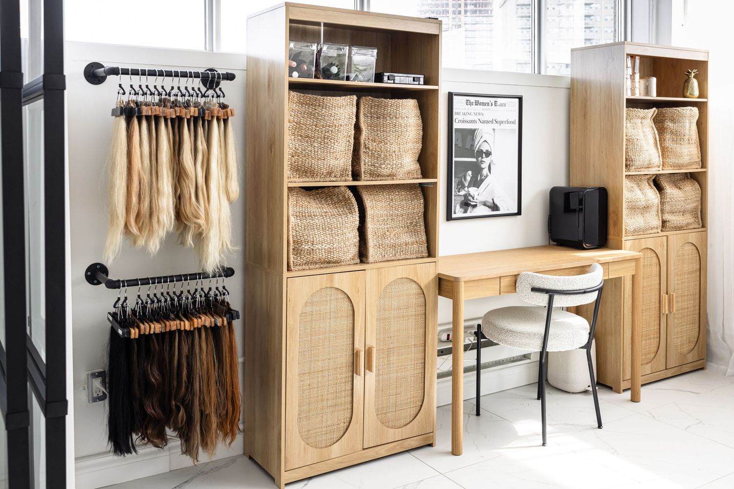 Modern wooden wall unit featuring storage cabinets, shelving, and hanging rods in a bright, minimalist interior setting.