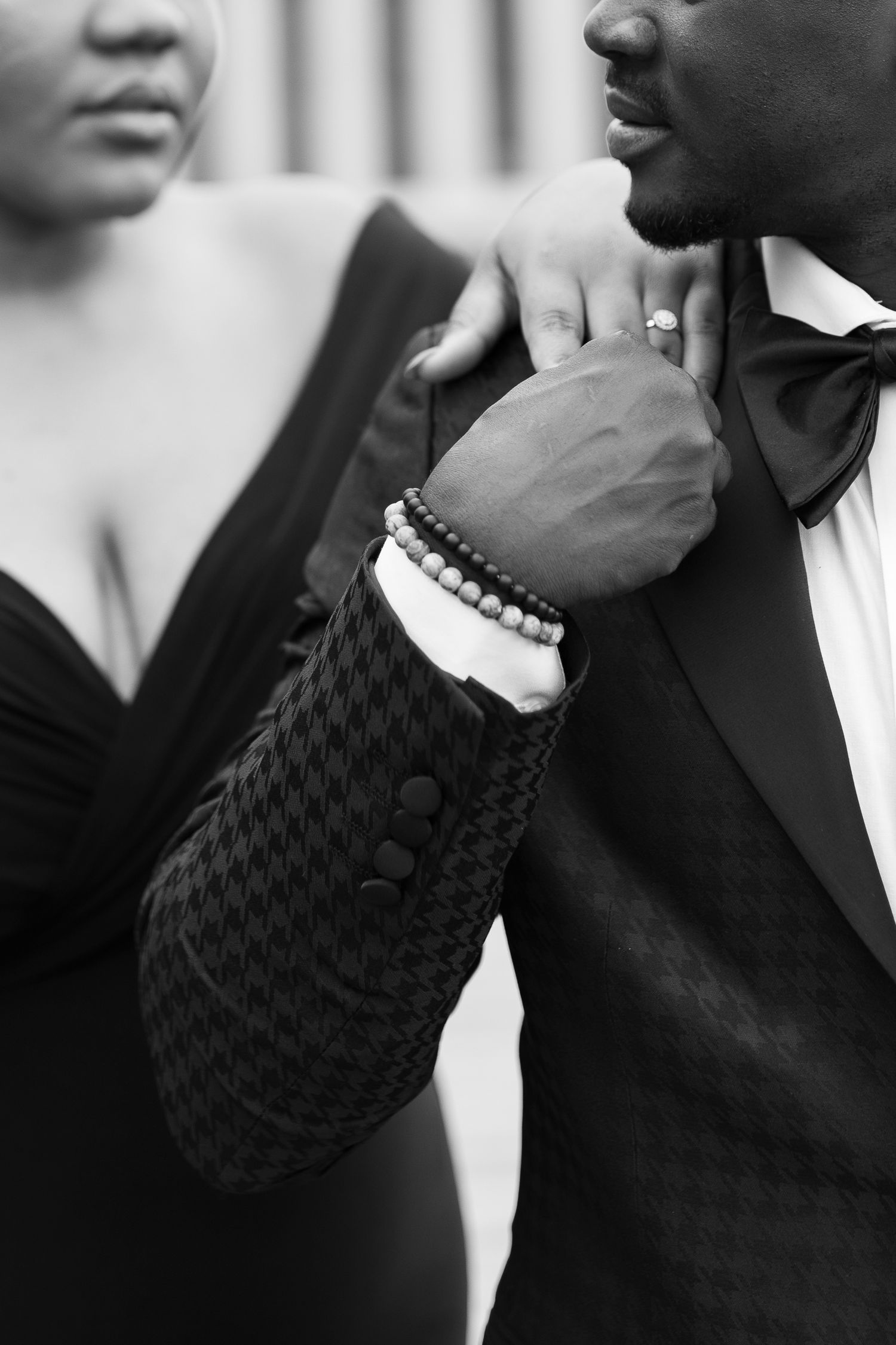 Black and white portrait series showing a person wearing a dark sweater and pearl bracelet in contemplative poses.