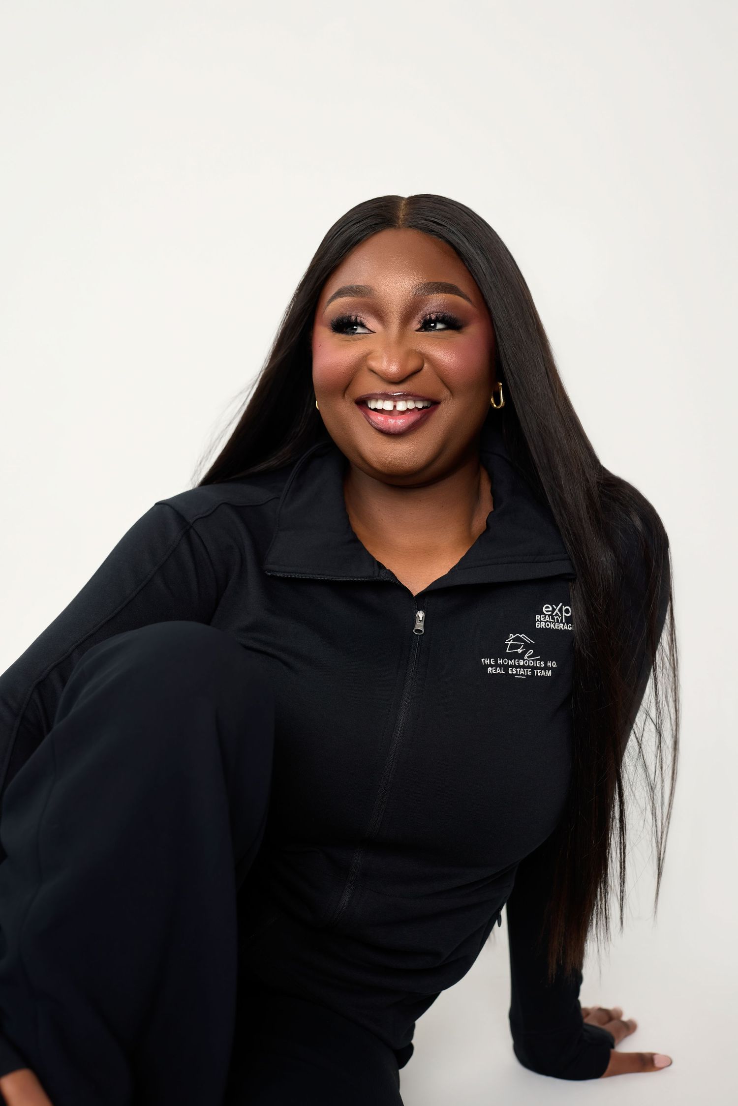 Professional portrait series showing a person in a black company uniform smiling against a white background.