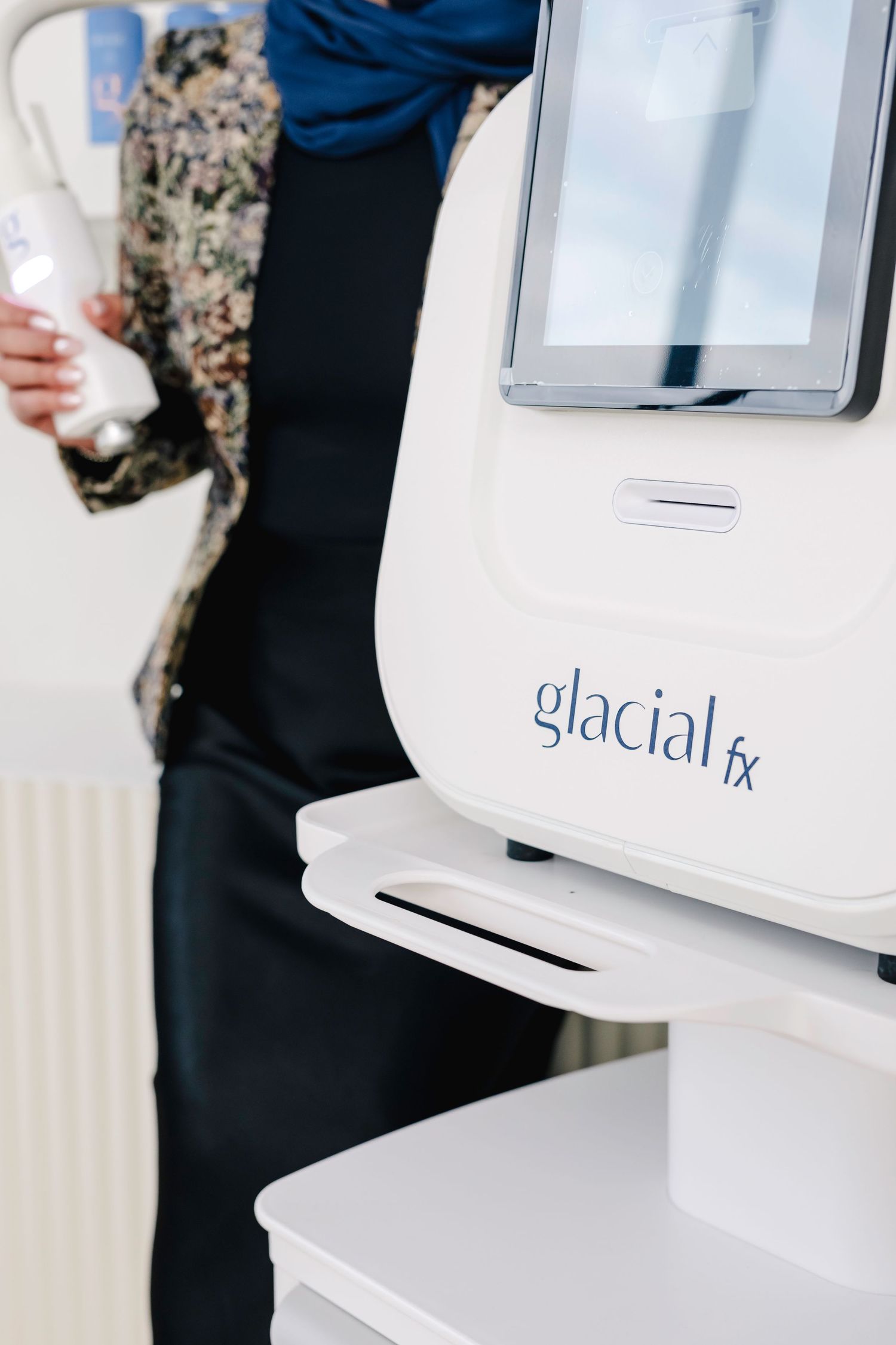 Close-up shot of a white Glacial RX medical device mounted on a stand against a white background.