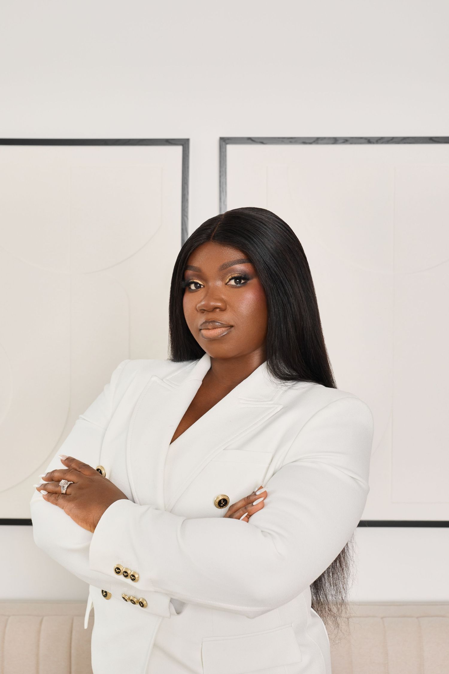 Professional studio portraits in white blazer against minimalist background showcase elegant business style and confidence.