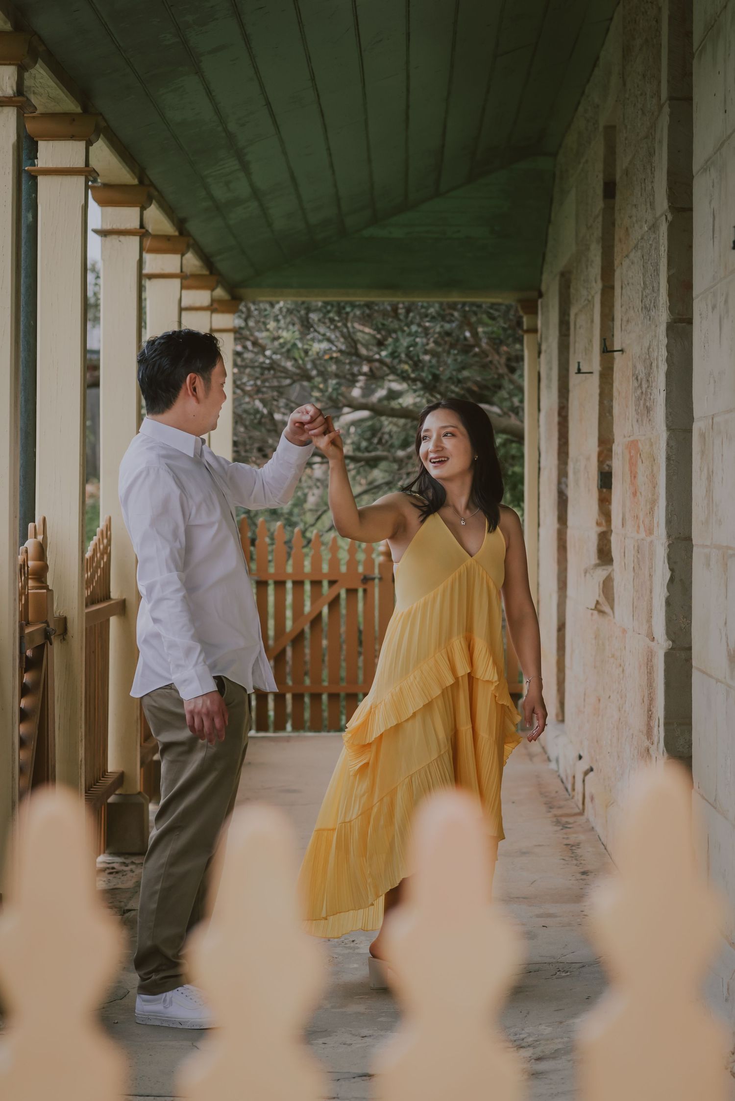 A lovely couple dancing together to relax, posing in front of a camera.