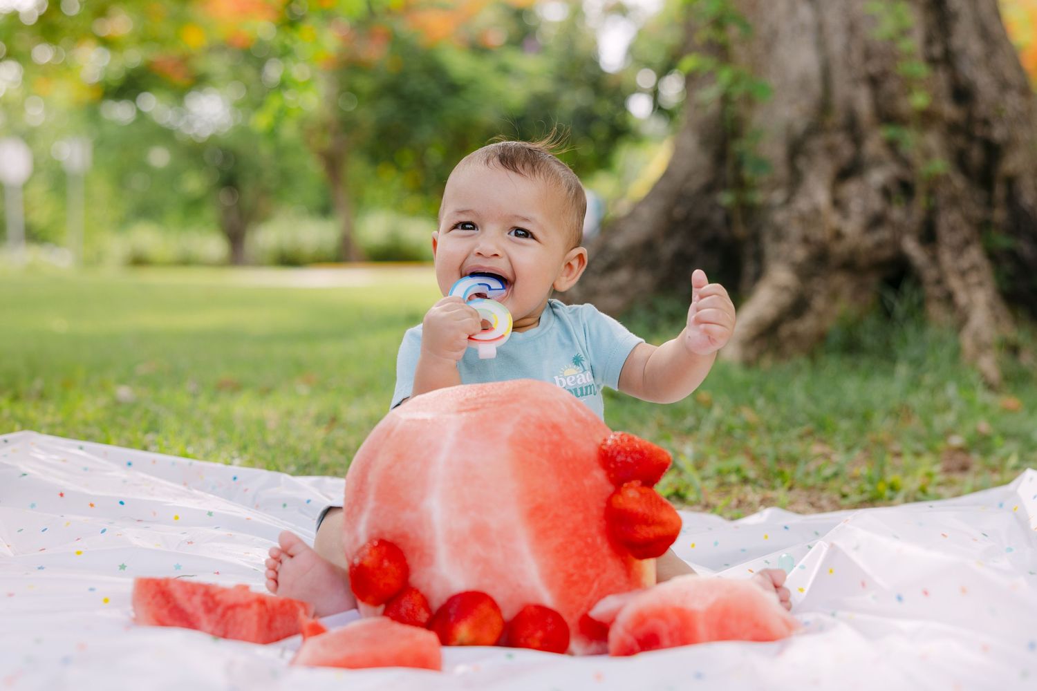 Children enjoy playing with juicy watermelon chunks outdoors on a summer day.