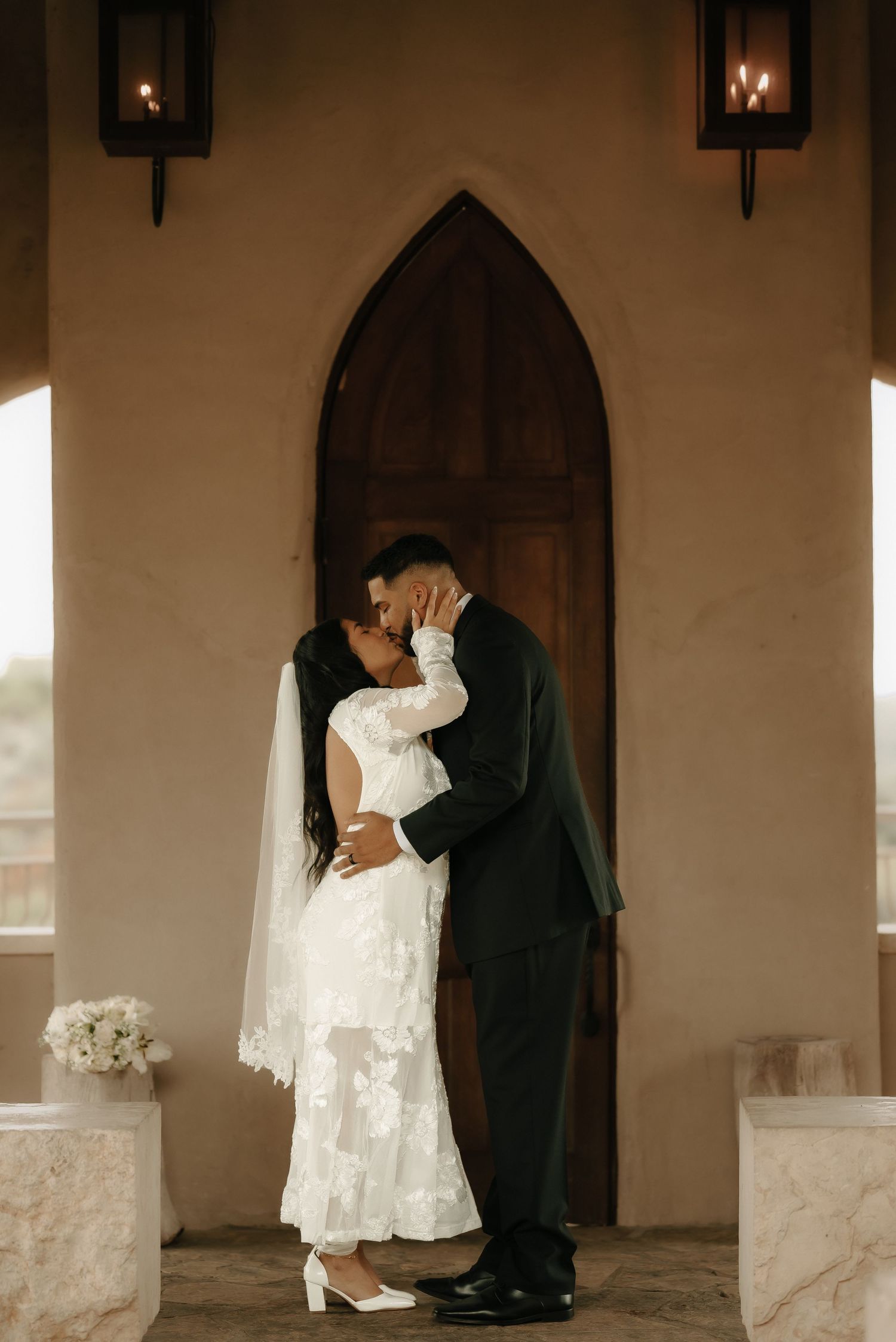 A romantic wedding photoshoot sequence showing tender moments between a couple in a church hallway.