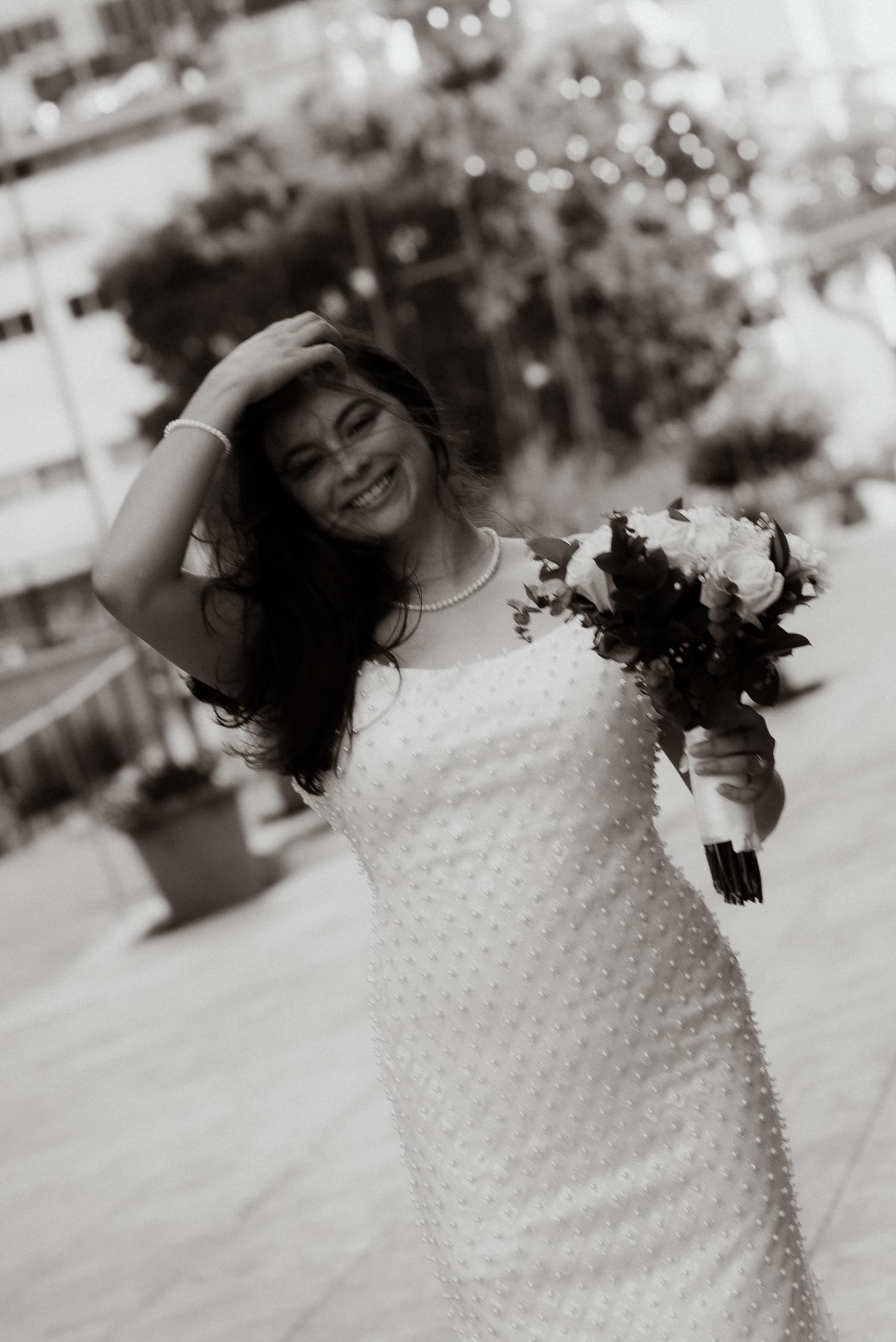 Artistic black and white series showing the texture and detail of a wedding dress.