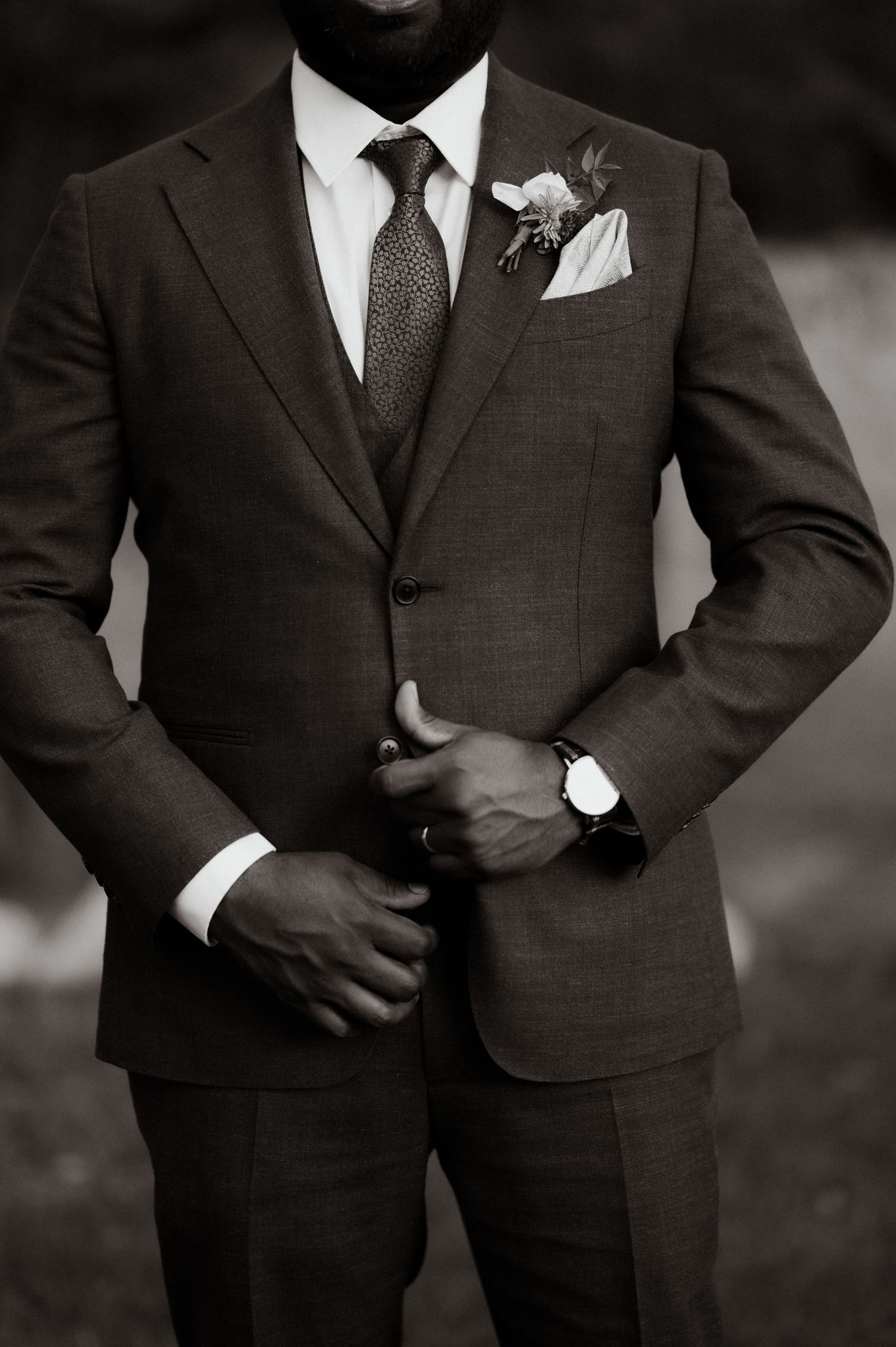 Formal black and white photo series showing groomsmen in dark suits.