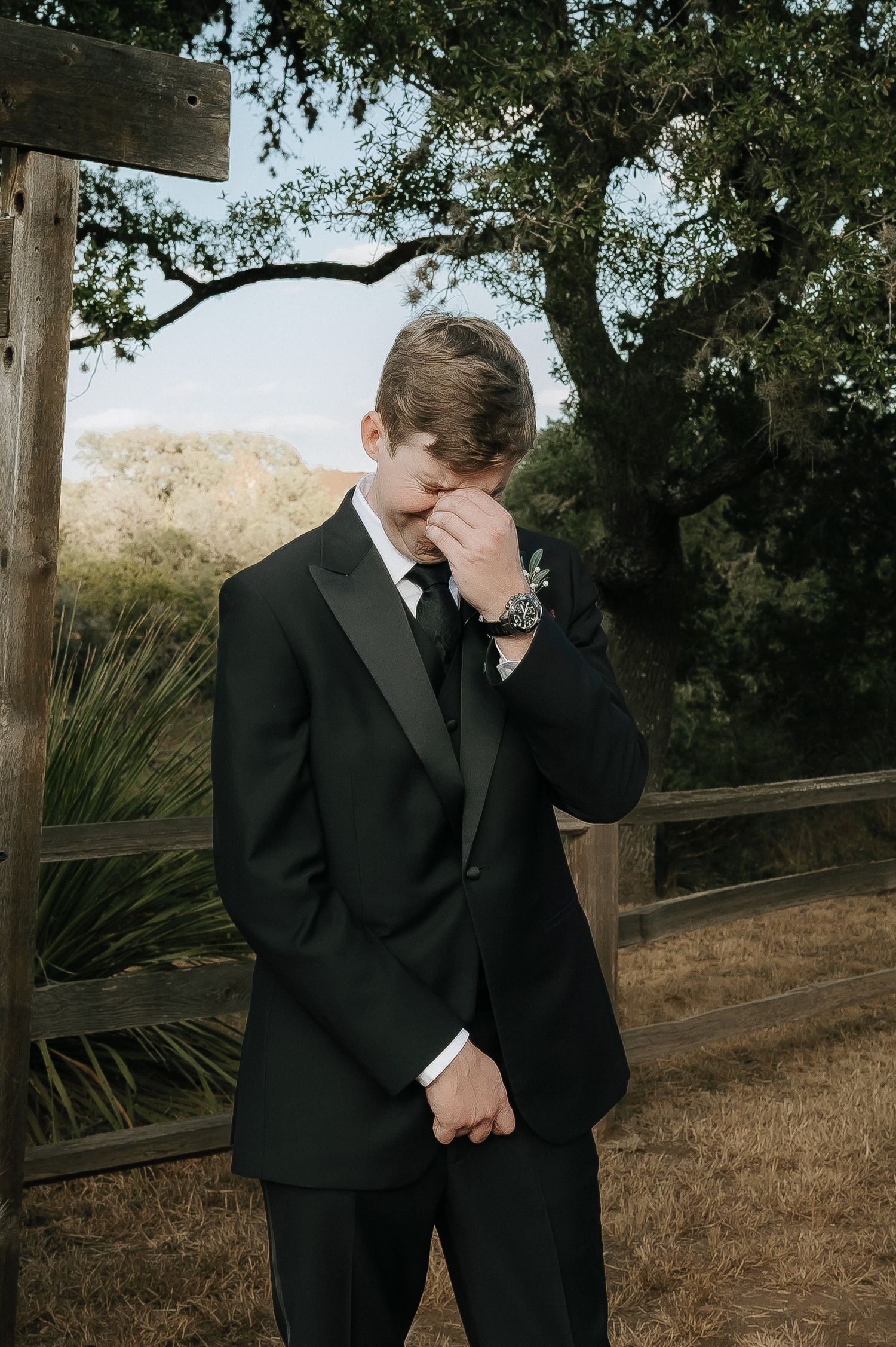 Emotional wedding moment captured in sequence as groom wipes tears in black suit outdoors.