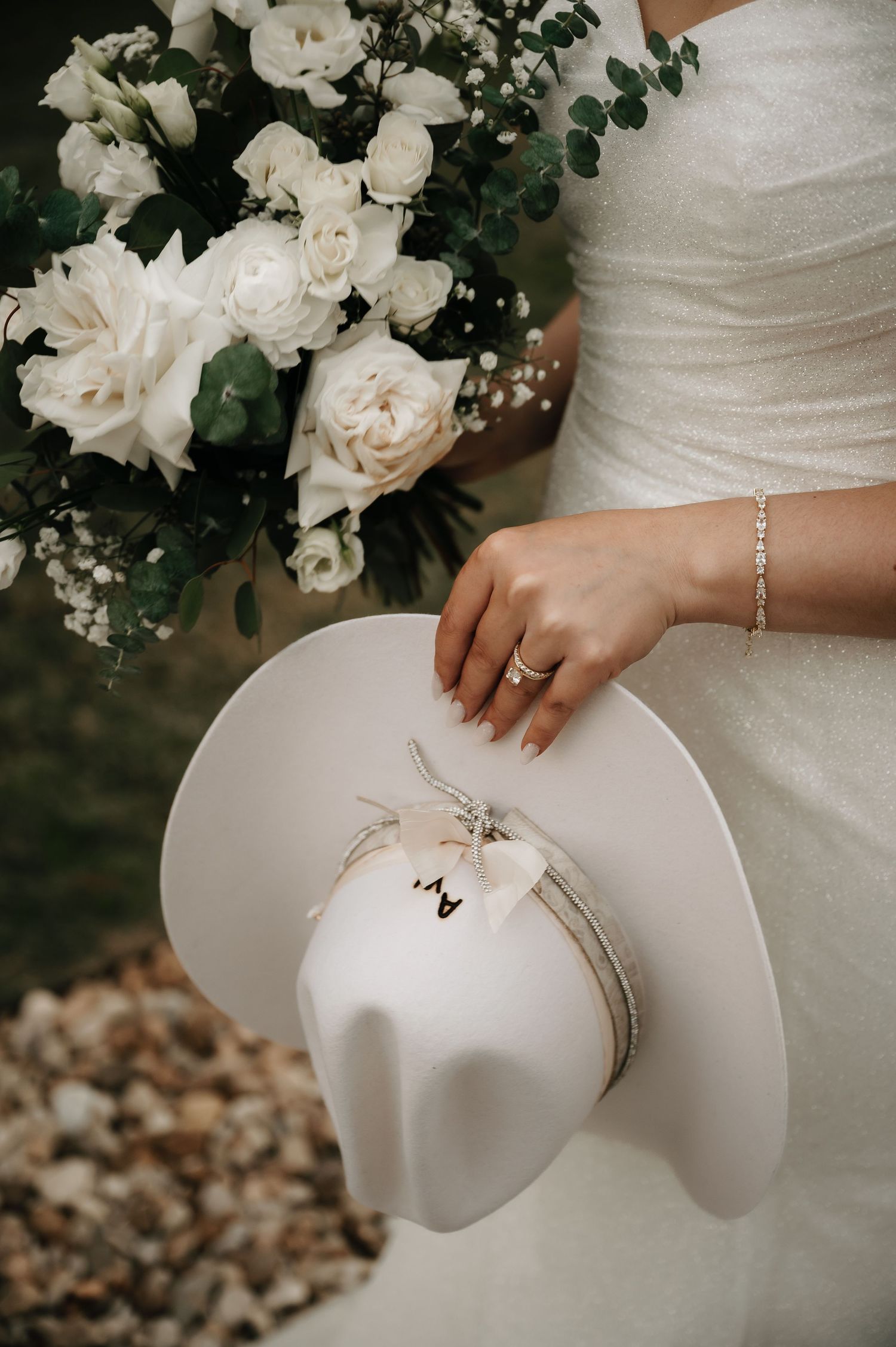 White roses and bridal details with delicate lace textures.