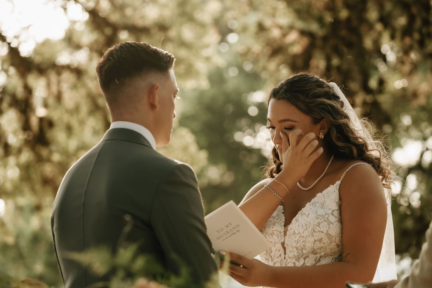 Intimate wedding ceremony moments captured in a series of candid outdoor photographs.