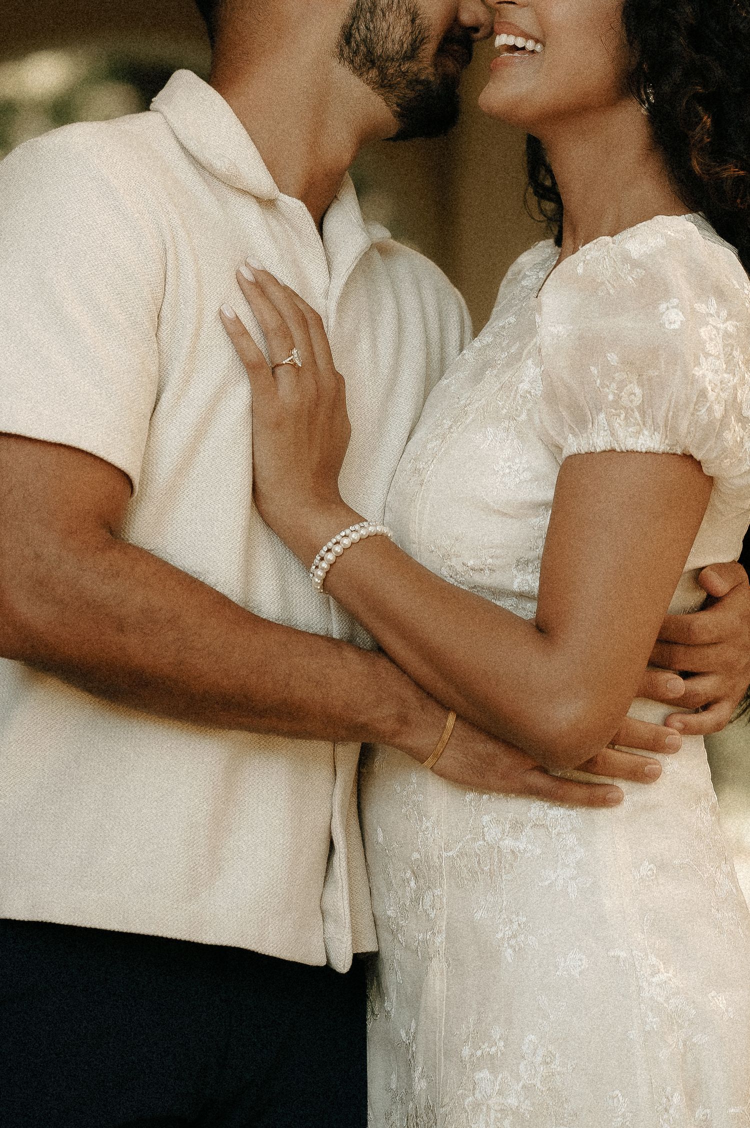 Romantic close-up portraits showing tender embraces in soft natural lighting.