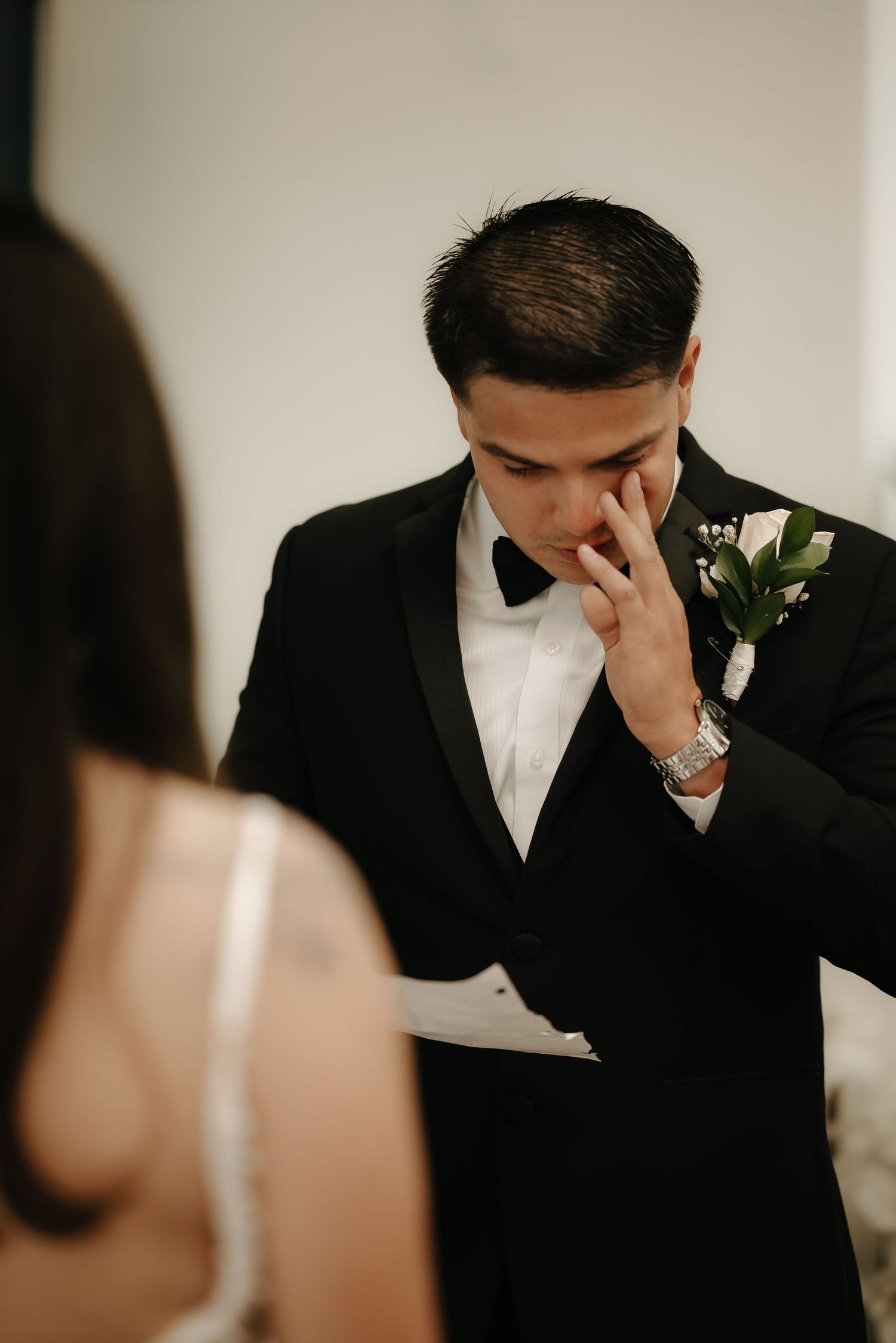 Emotional wedding day moment captured in intimate indoor setting.