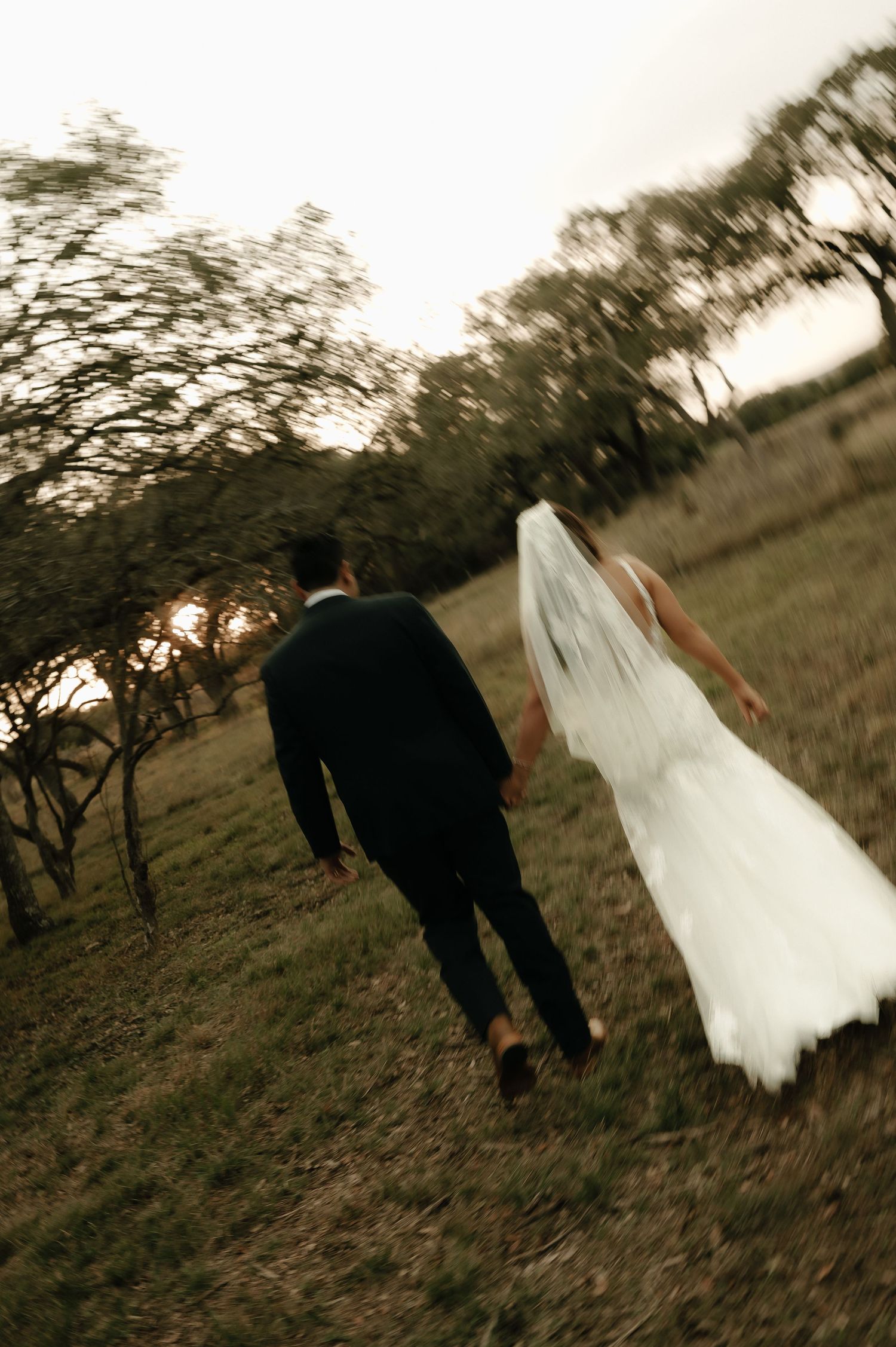 Artistic wedding photo sequence showing couple walking through a field at sunset.