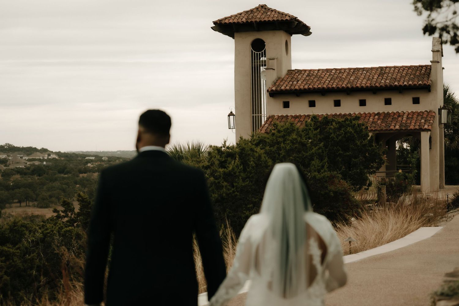 Spanish-style wedding venue with terra cotta roof tiles and stucco walls.