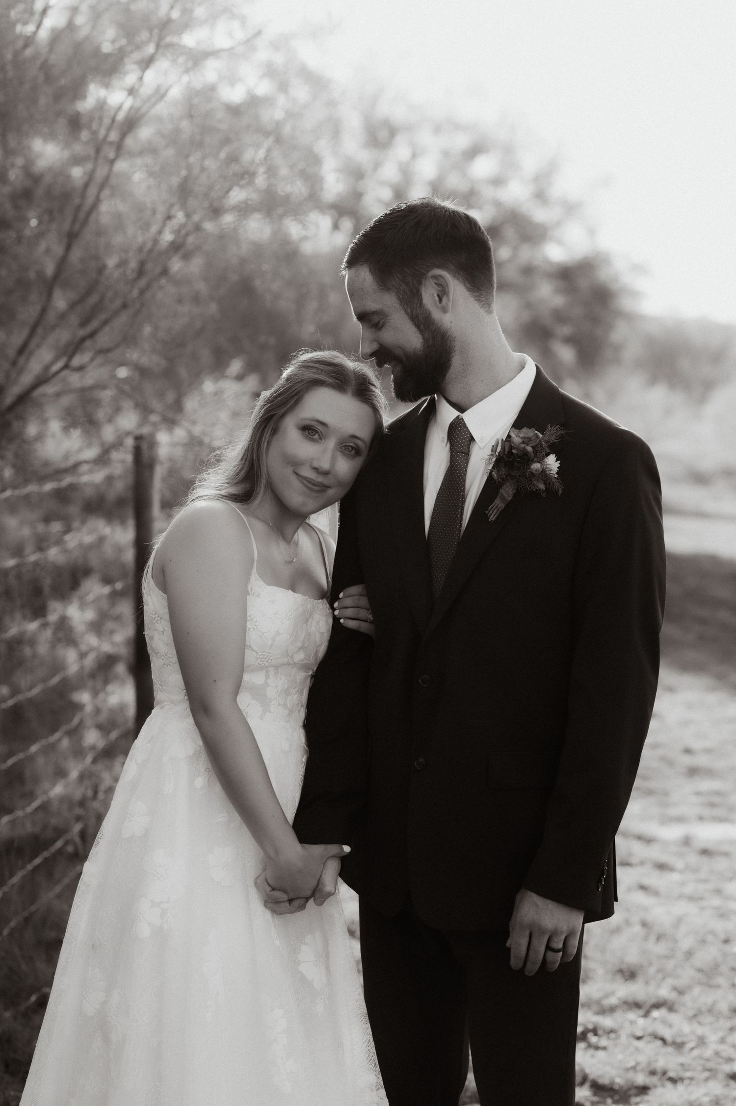 Intimate black and white wedding portraits showing tender moments between the newlyweds.