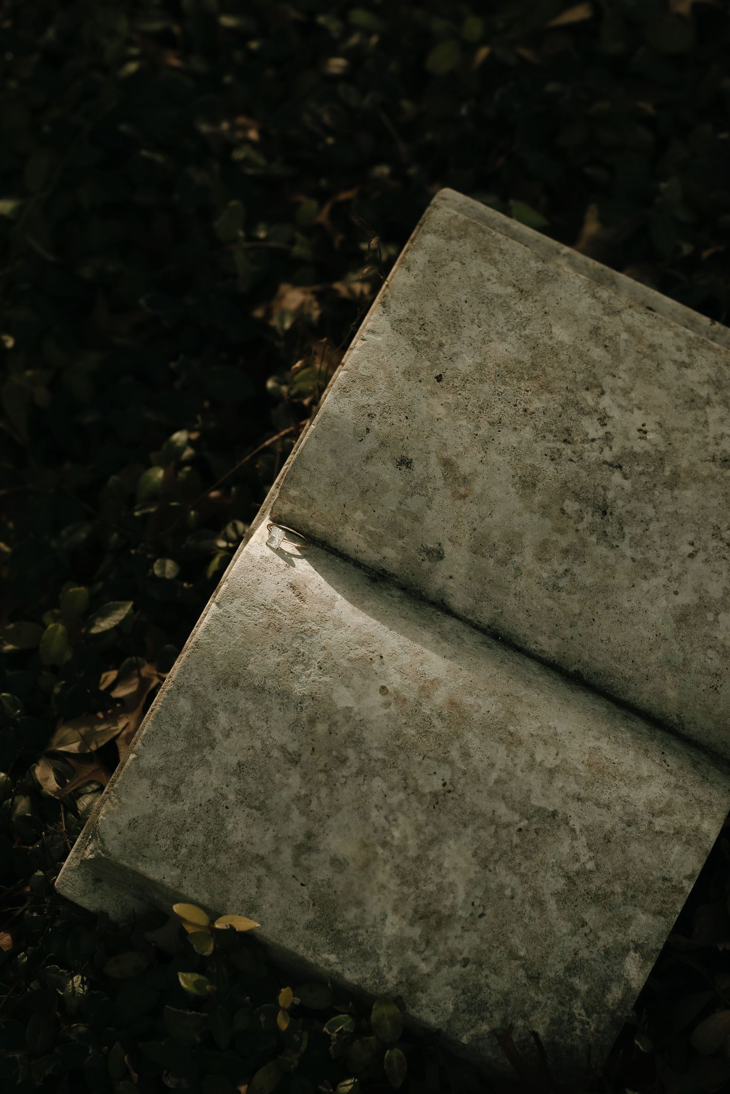 Weathered concrete blocks arranged diagonally against a dark background.