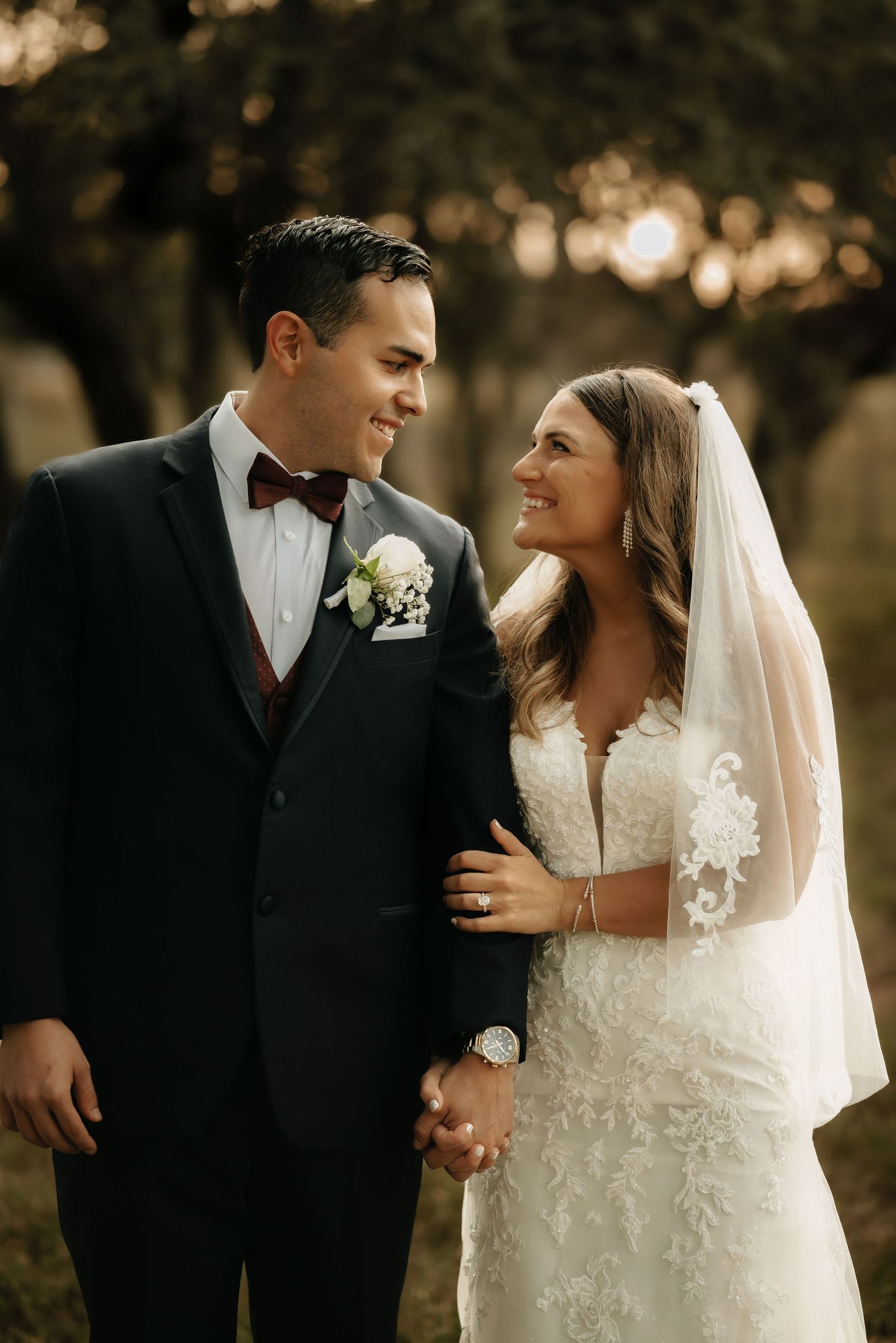Elegant wedding couple sharing intimate moments during golden hour portrait session.