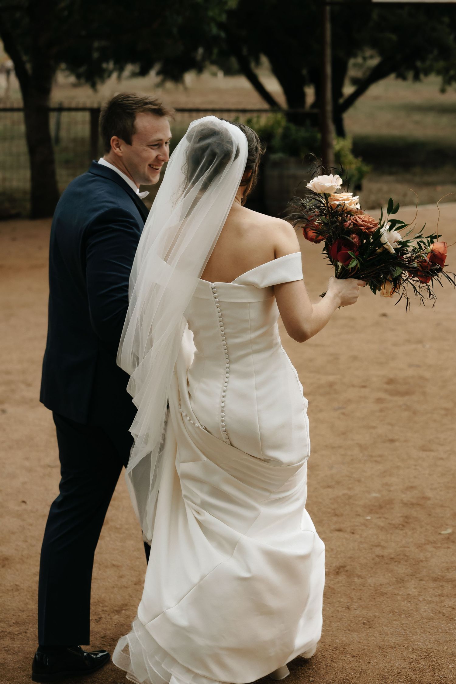 Wedding sequence showing couple in formal attire outdoors with autumn floral bouquet.