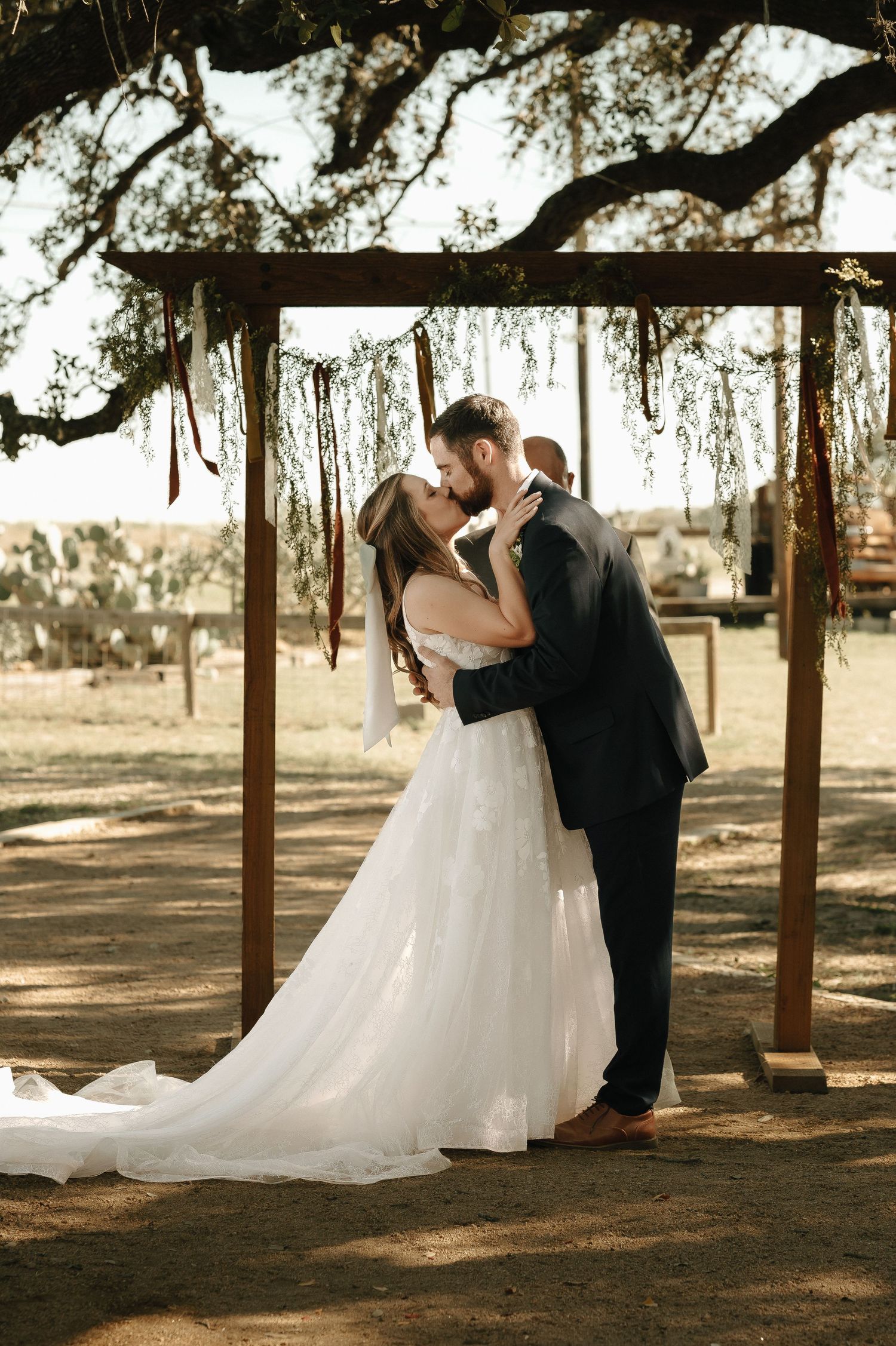 A series of romantic wedding photos showing couple dancing under wooden beams in natural lighting.