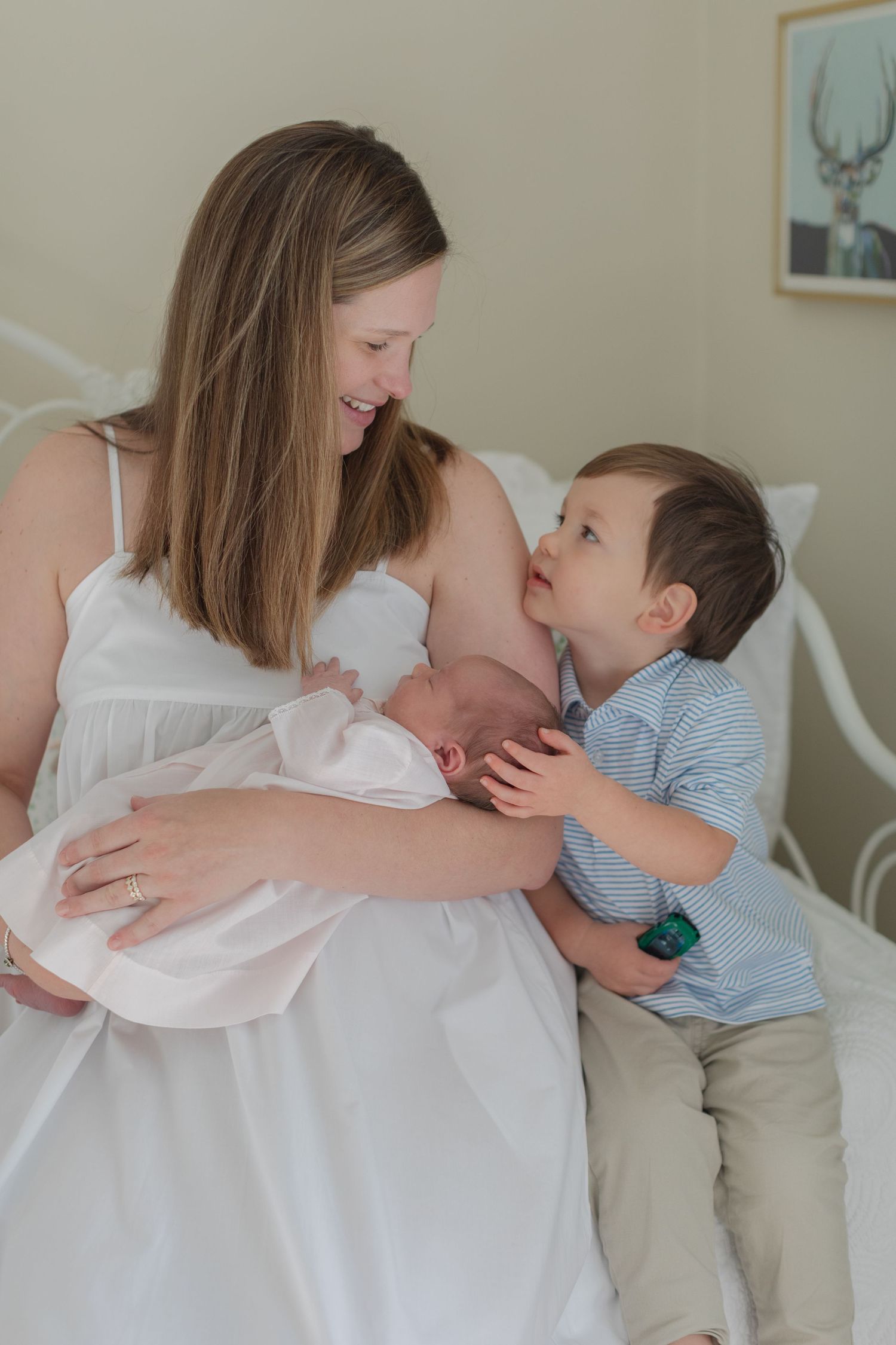 A tender moment shared between parent and child in a light-filled room with neutral decor.