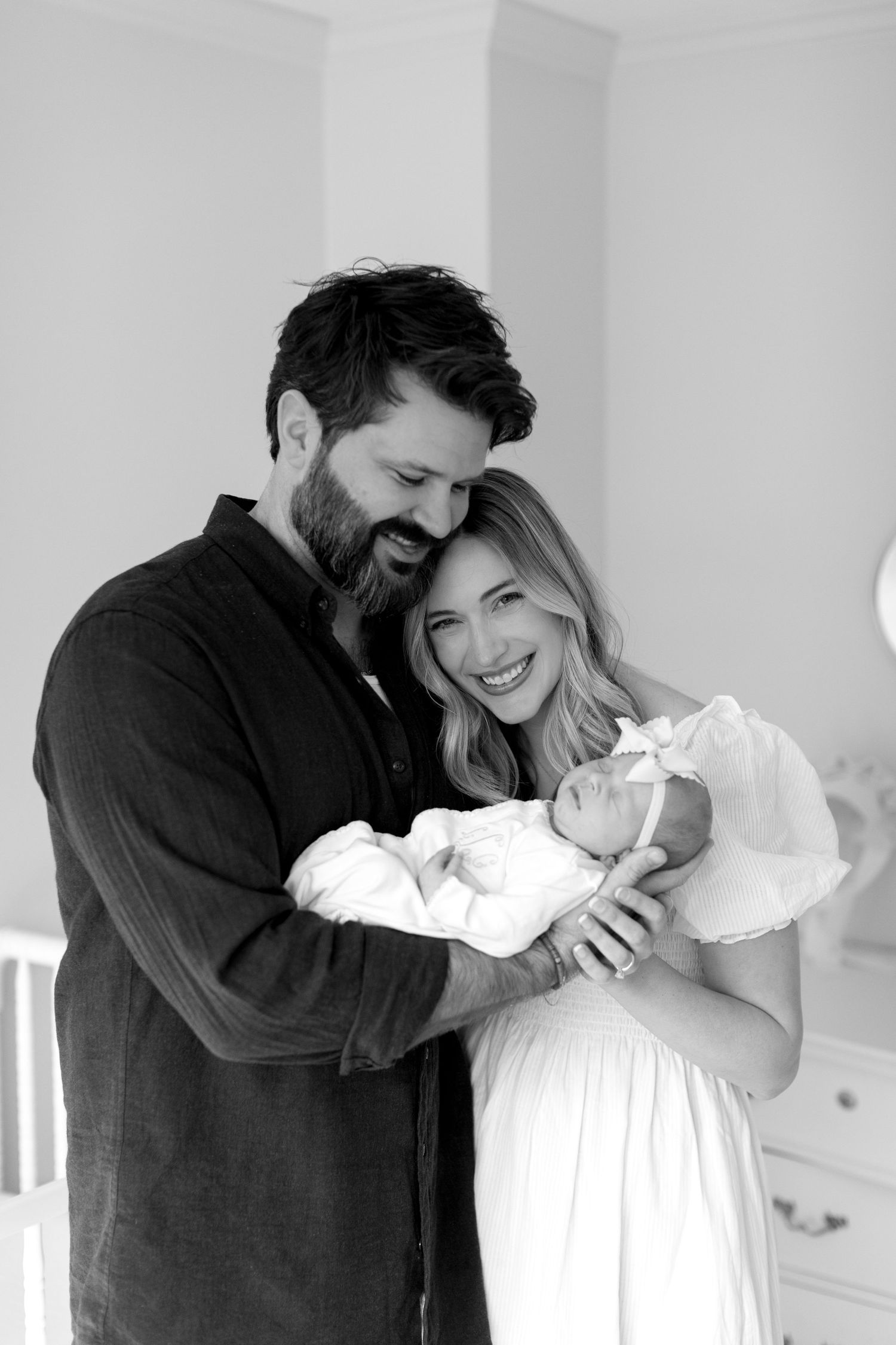 Series of joyful black and white photographs capturing sweet moments of laughter and affection.