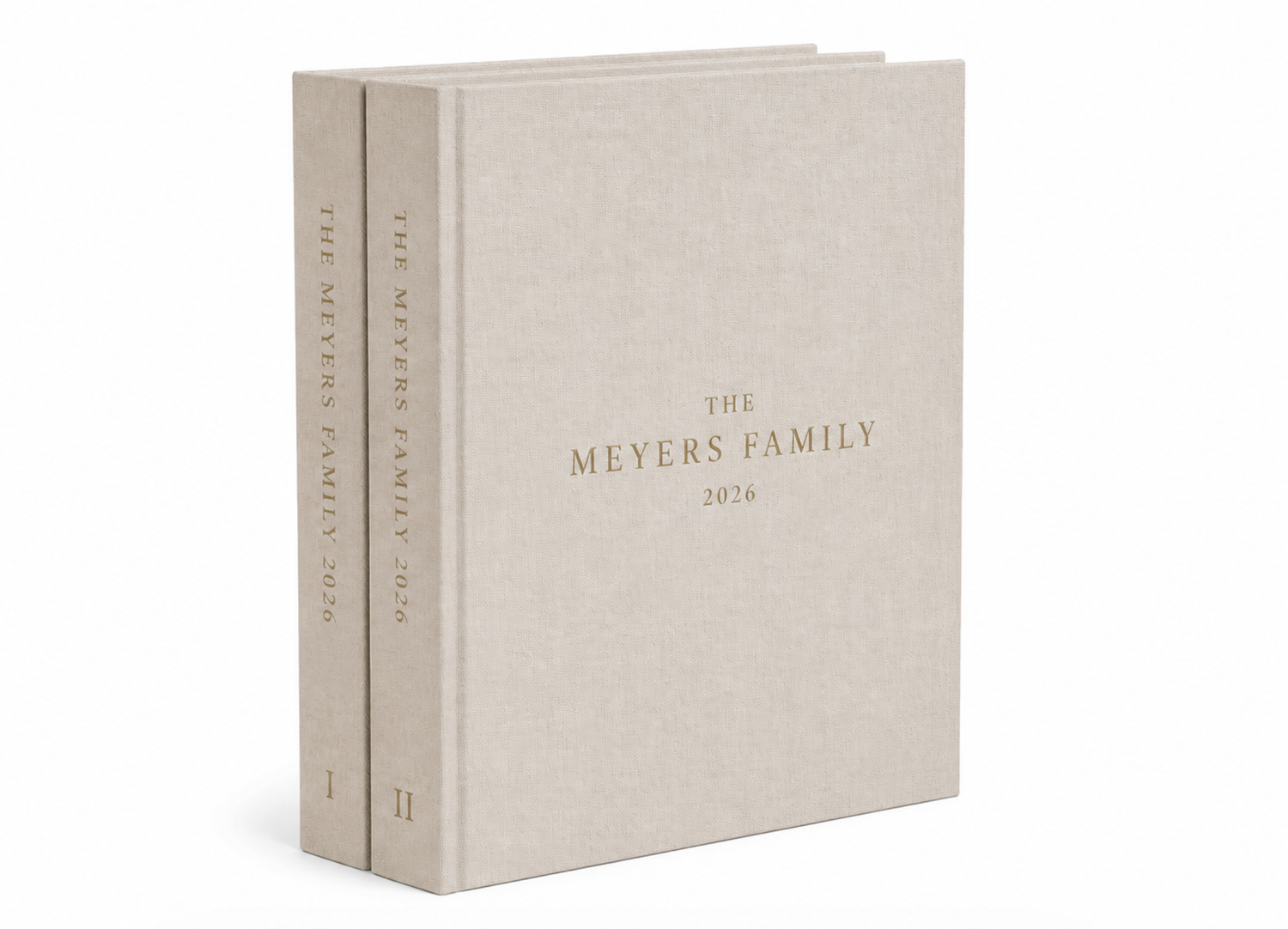 Two-volume beige linen family archive book set personalized with The Meyers Family 1876 embossed in gold lettering.