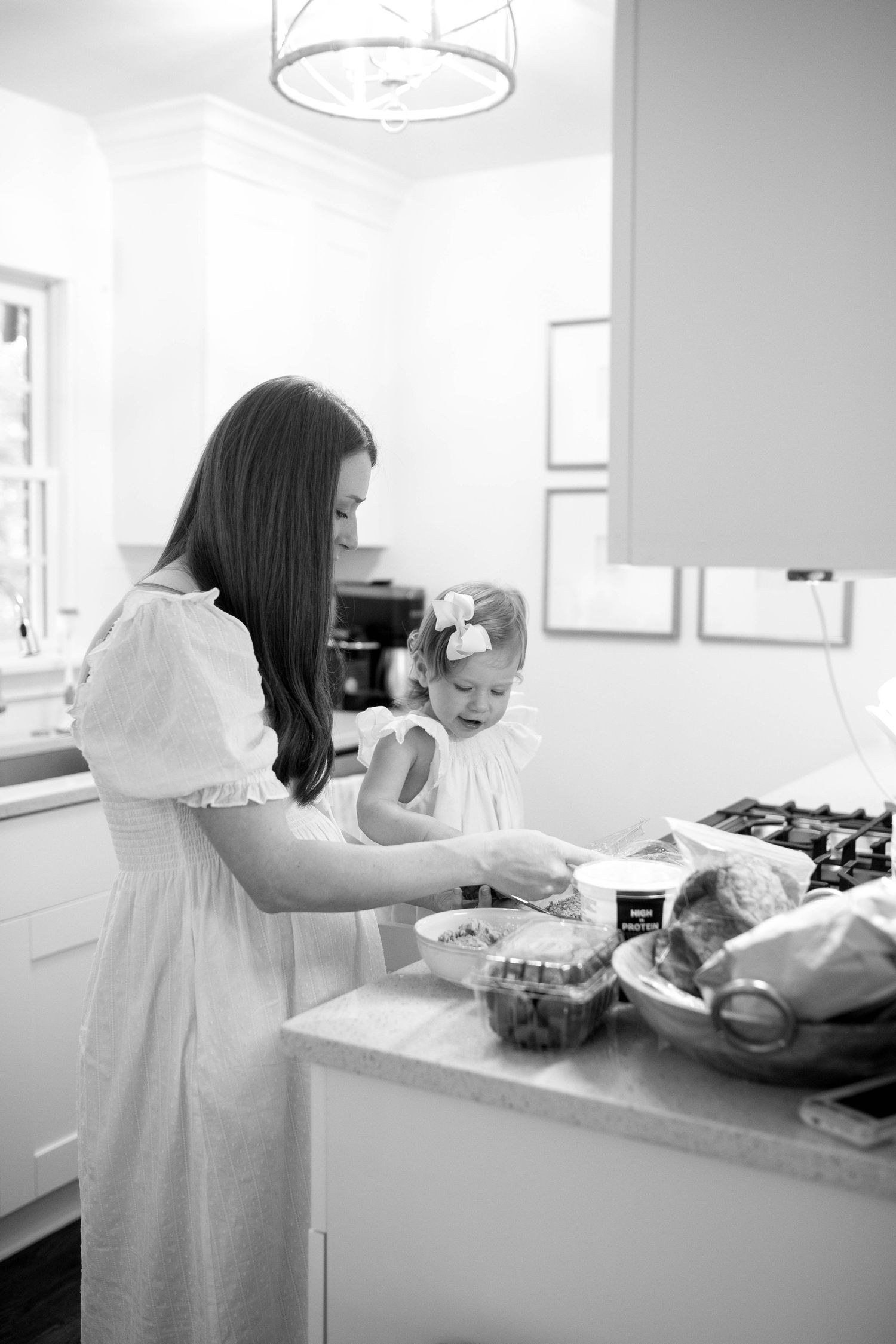 A sequence of black and white photos showing domestic kitchen activities.