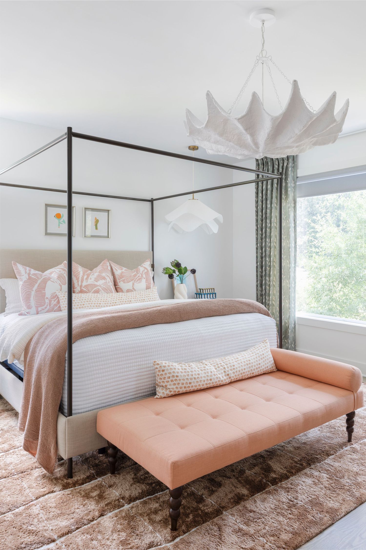 Elegant bedroom with canopy bed, blush bench, and statement shell pendant light - Atlanta Interior Design Photography