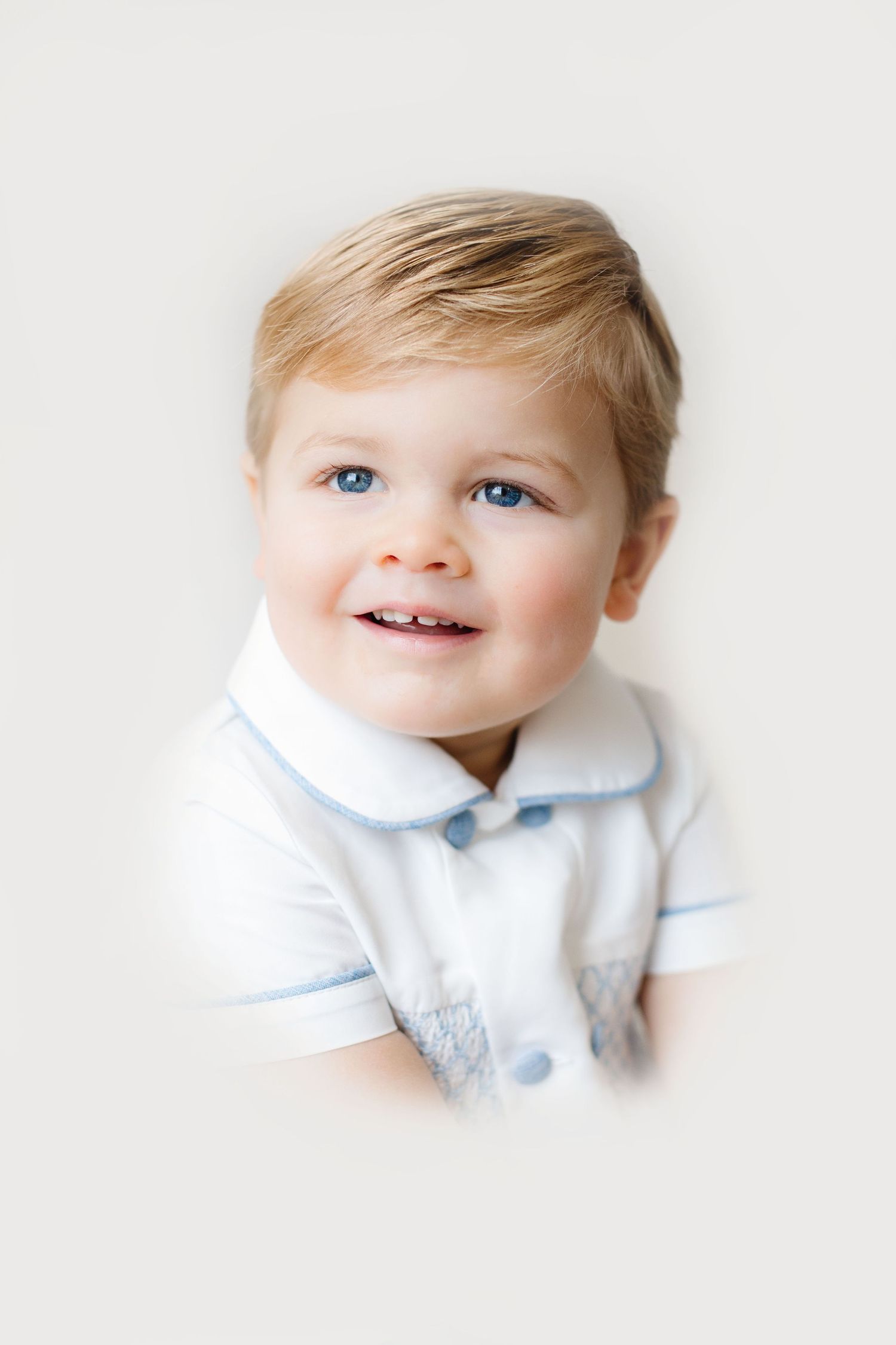 A series of three portraits showing a young child in a white collared shirt against a bright white background.