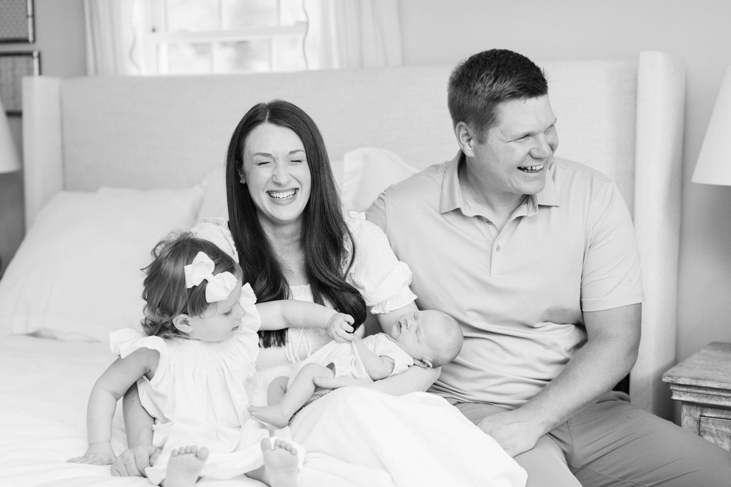 A black and white collage shows multiple tender moments between a couple in various casual indoor settings.