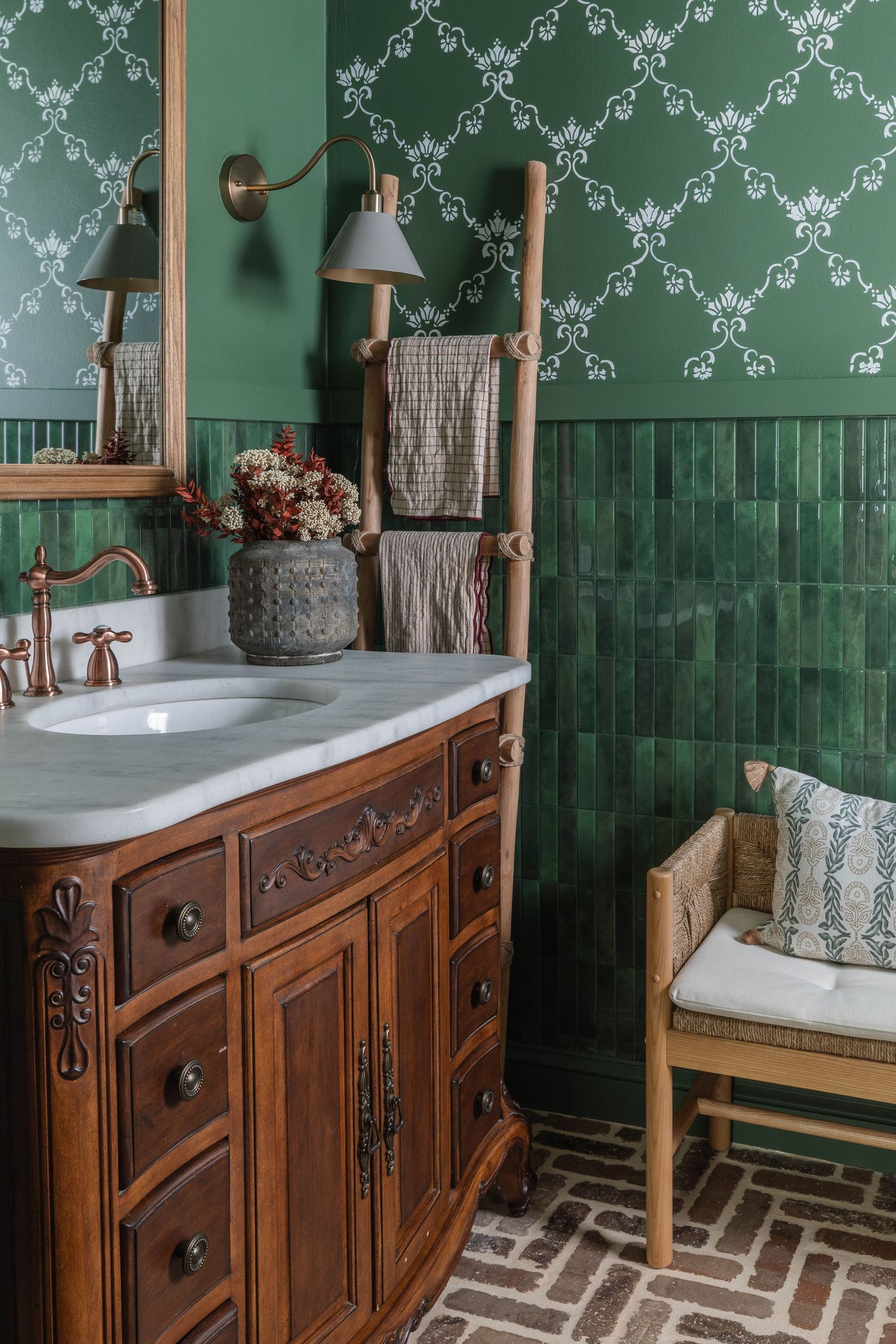 Traditional bathroom vanity with ornate wood details and emerald green wallpaper and tile.  Atlanta Interior Design Photography