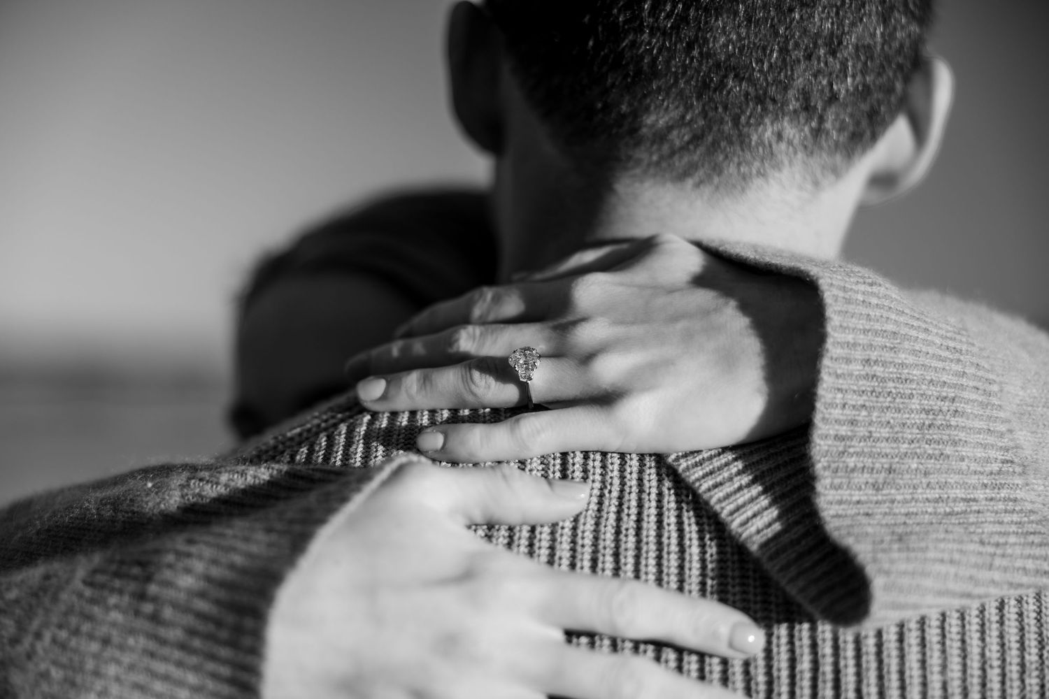 A series of black and white close-up shots showing intimate wedding moments.