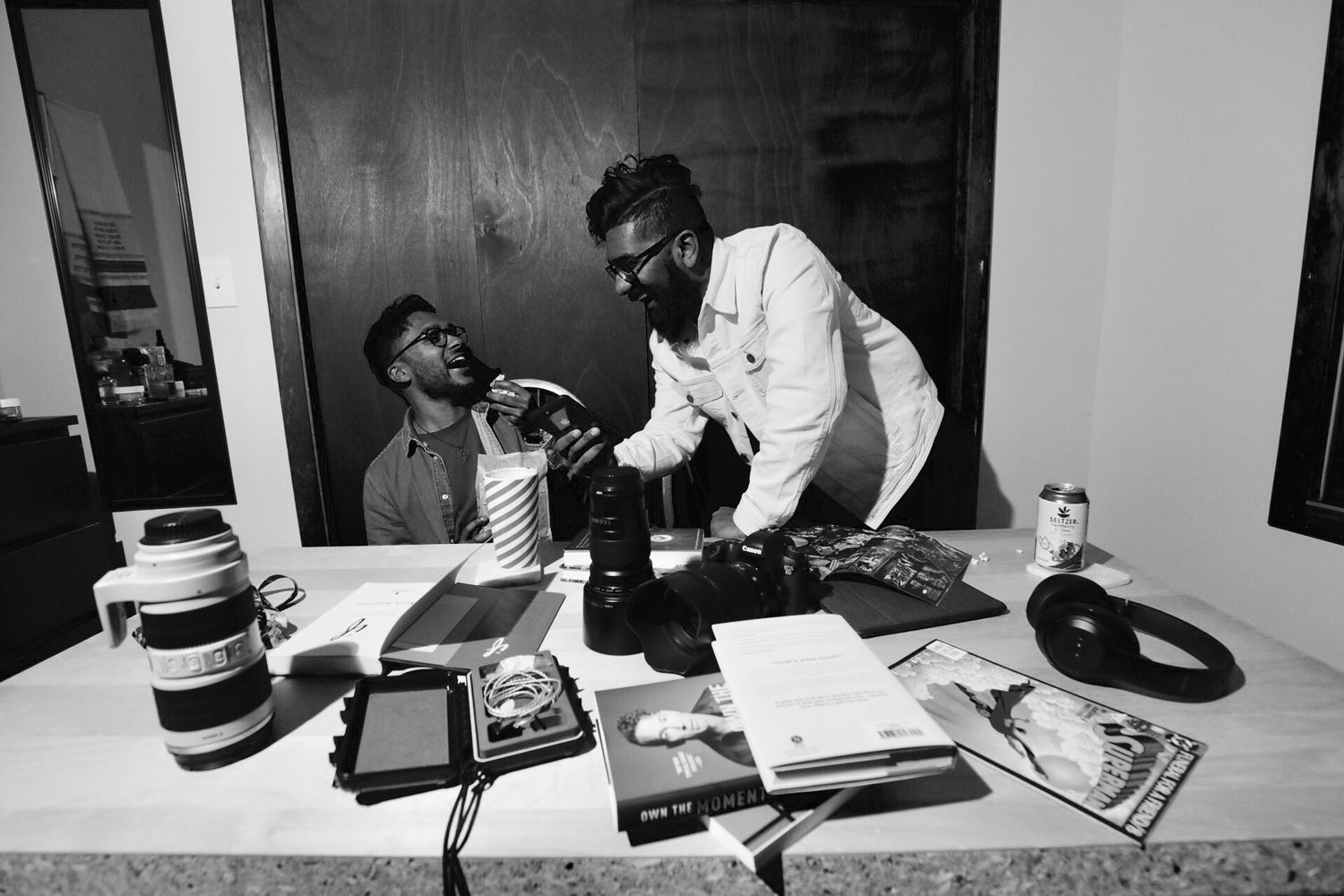 Black and white photography showing wedding preparation details in minimalist style.