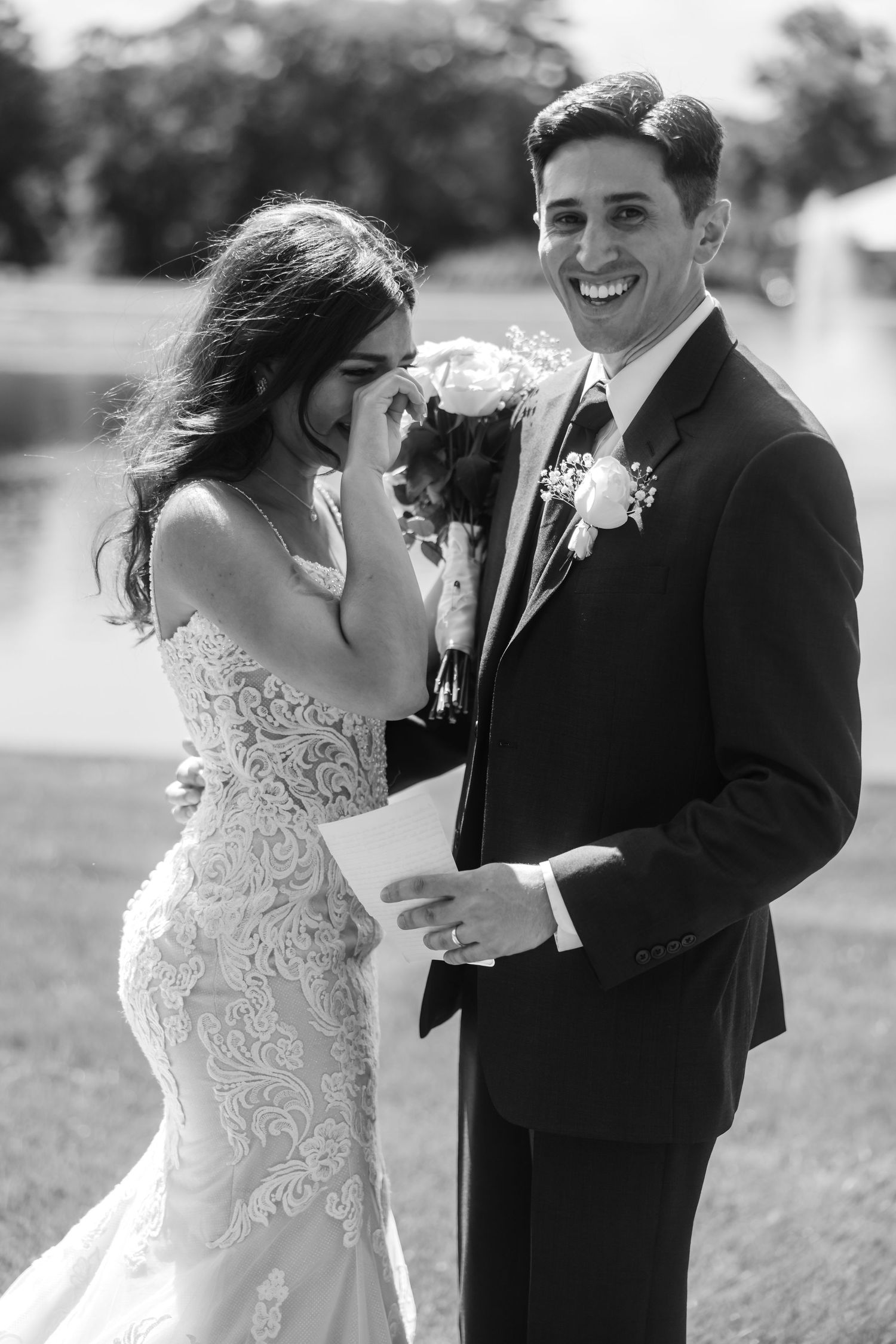 A romantic black and white photo series showing a couple sharing joyful moments on their wedding day.