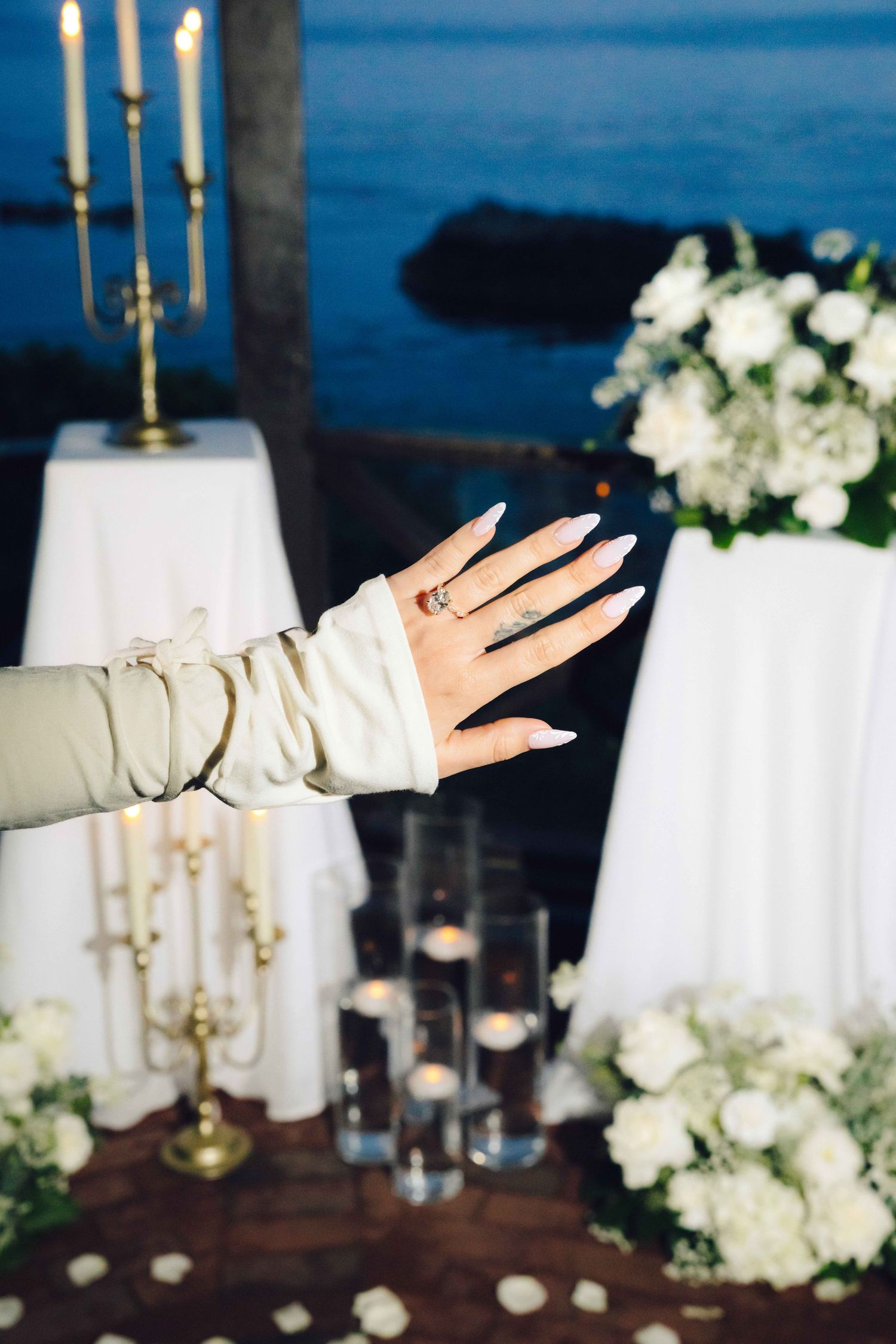 Girl showing off her Wedding ring under the gazebo located in Heisler Park